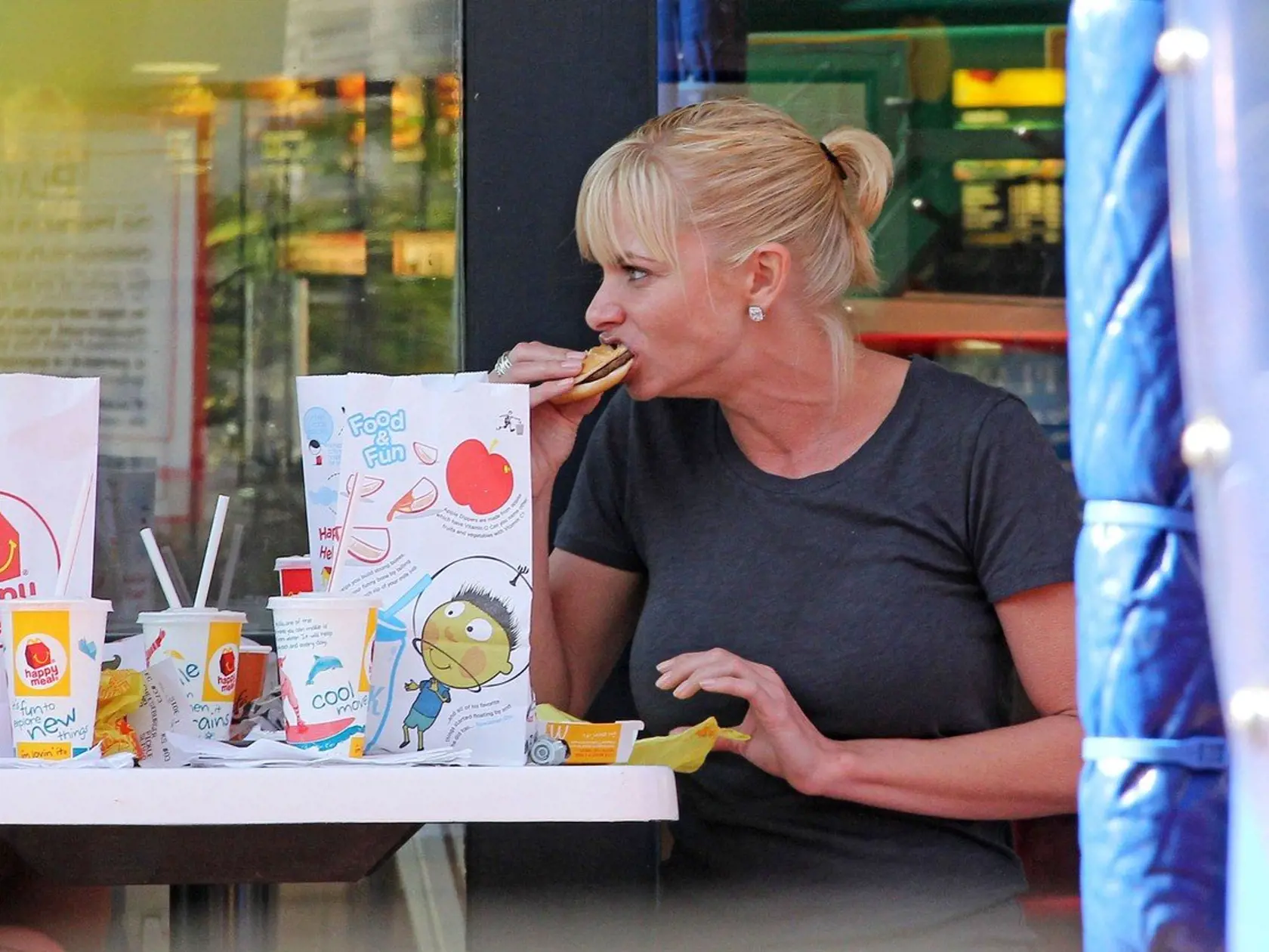***EXCLUSIVE*** LOS ANGELES, CA - JULY 11: Actress Jaime Pressly holds the hand of her son Dezi James after picking him up from his weekly karate class on July 11, 2011 in Los Angeles, Callifornia. Jaime heads over to a local McDonald's to meet up with a friend and her son for a play date. Jaime ate a burger and cleaned up on Dezi's french fries. The mother son duo picked up a DVD from a Redbox location and headed home., Image: 96531820, License: Rights-managed, Restrictions: *** Sales in UK, An