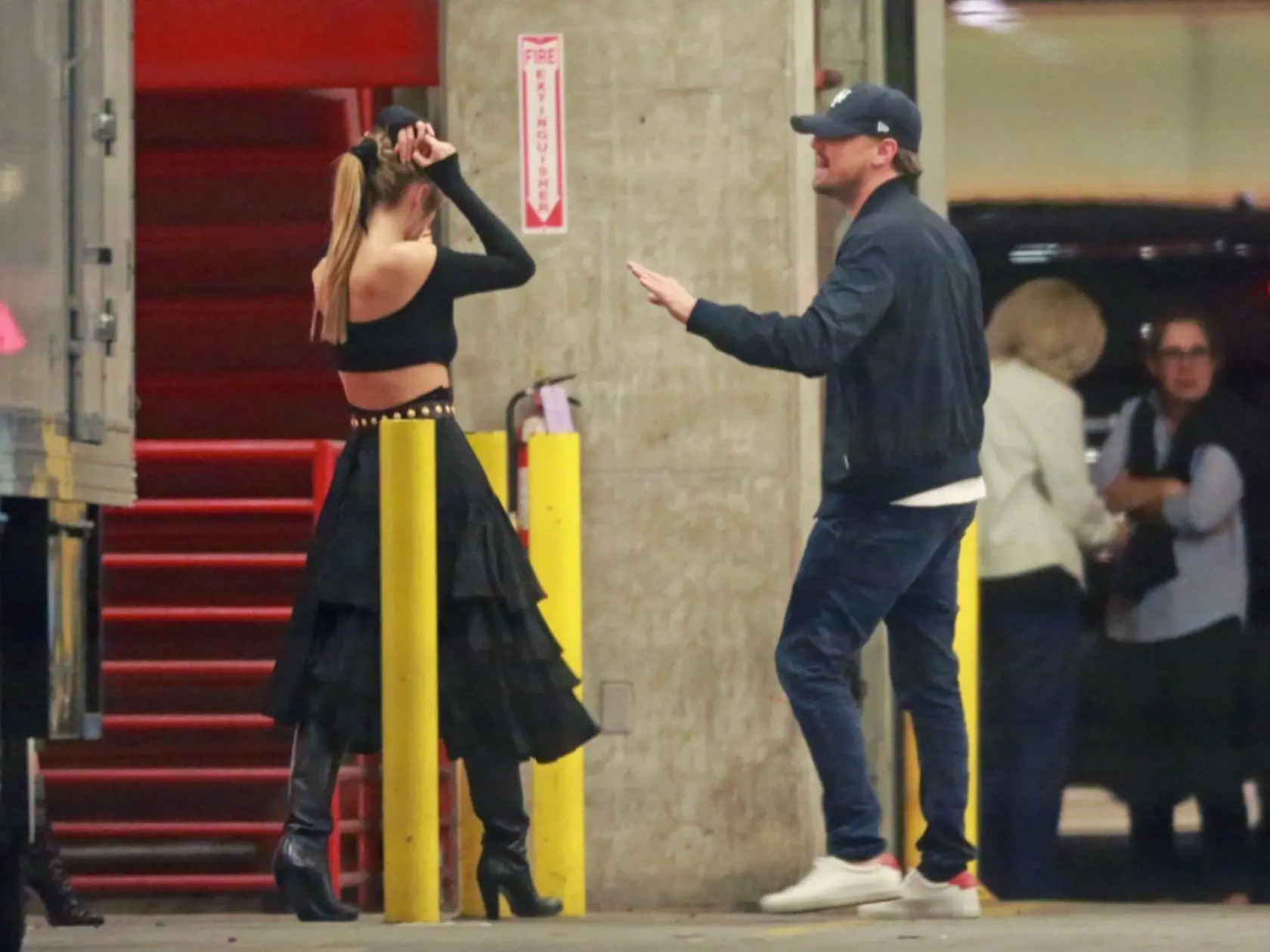 EXCLUSIVE: *NO WEB UNTIL 11PM PST, FEBRUARY 12, 2018* *NO USA PRINT* *PREMIUM EXCLUSIVE RATES APPLY* Leonardo DiCaprio attends Ellen DeGeneres' LA birthday party with model girlfriend Camila Morrone. DiCaprio, who was dressed down in a t-shirt, jeans and his trademark baseball cap, was spotted putting his arm around his 20-year-old girlfriend outside the star-studded bash at The Lot Studios in West Hollywood on Saturday February 10, 2018. DiCaprio, who split with Nina Agdal last year, was first 