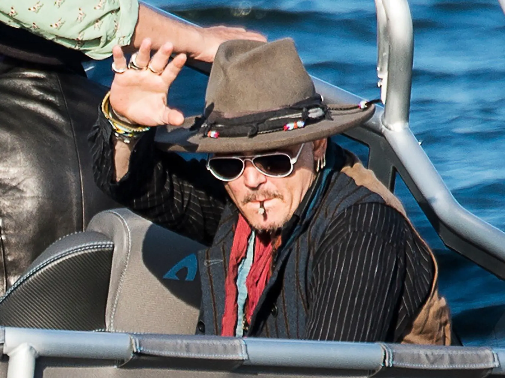 *** UK OUT UNTIL WEDNESDAY ***<br/>US  actor Johnny Depp  waves from a boat on his way to the concert with his band Hollywood Vampires at the Grona Lund amusement park in Stockholm, on May 30, 2016<br/> <br/><br/>, Image: 288175307, License: Rights-managed, Restrictions: United Kingdom OUT - Sweden OUT, Model Release: no, Credit line: Profimedia, AFP