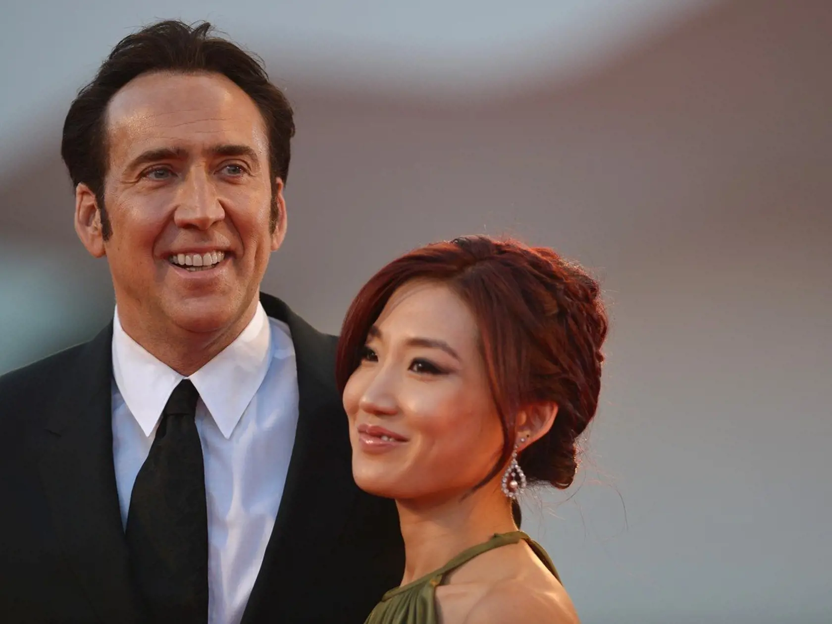 US actor Nicolas Cage and his wife Alice Kim arrive for the screening of "Joe" presented in competition at the 70th Venice Film Festival on August 30, 2013 at Venice Lido., Image: 170853751, License: Rights-managed, Restrictions: , Model Release: no, Credit line: Profimedia, AFP