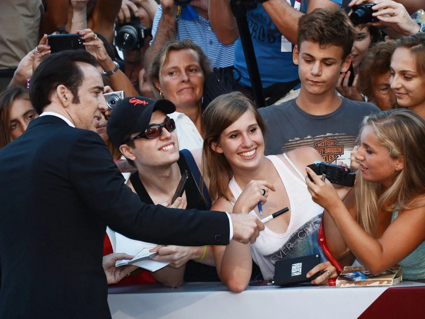 2274342 Italy, Venezia. 08/30/2013 Actor Nicolas Cage signs autographs before the screening of the film Joe at the 70th International Film Festival., Image: 170945850, License: Rights-managed, Restrictions: Mandatory credit, Model Release: no, Credit line: Profimedia, Sputnik