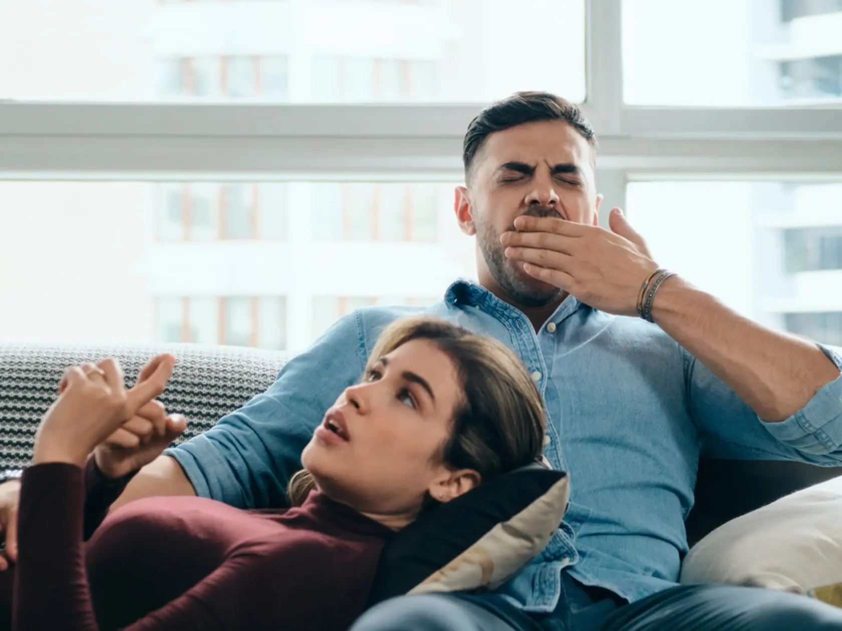 Man,Yawning,During,Boring,Conversation,With,Partner