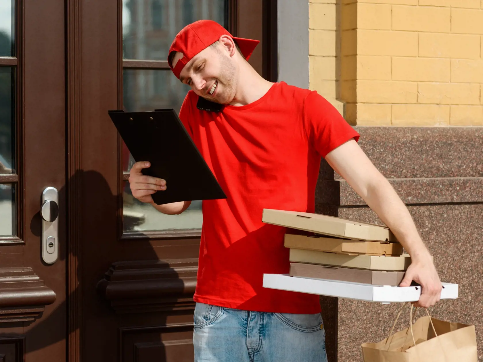 Delivery,Man,Near,Customer's,House,,Checking,The,Receipt,And,Holding