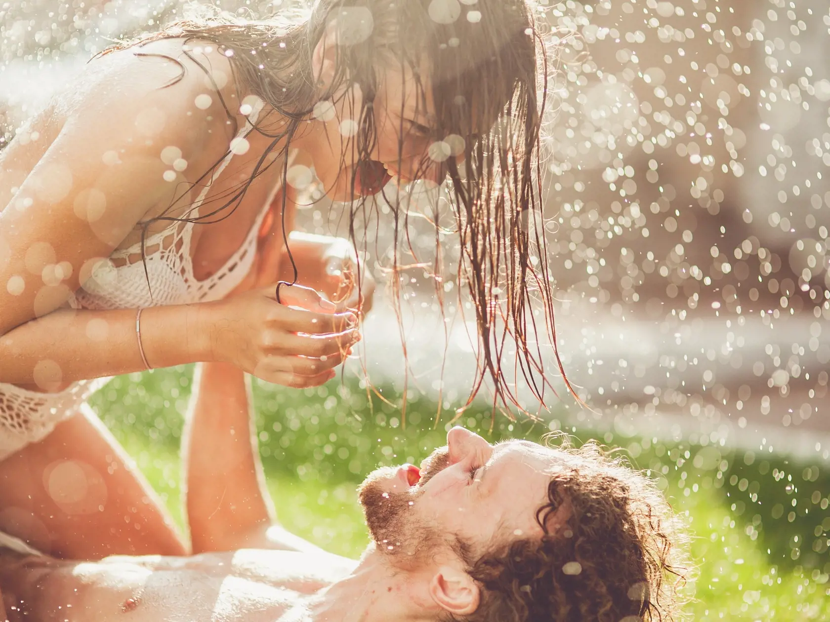 Young,Couple,Hugging,And,Under,A,Rain,,In,Passion,,Outdoor