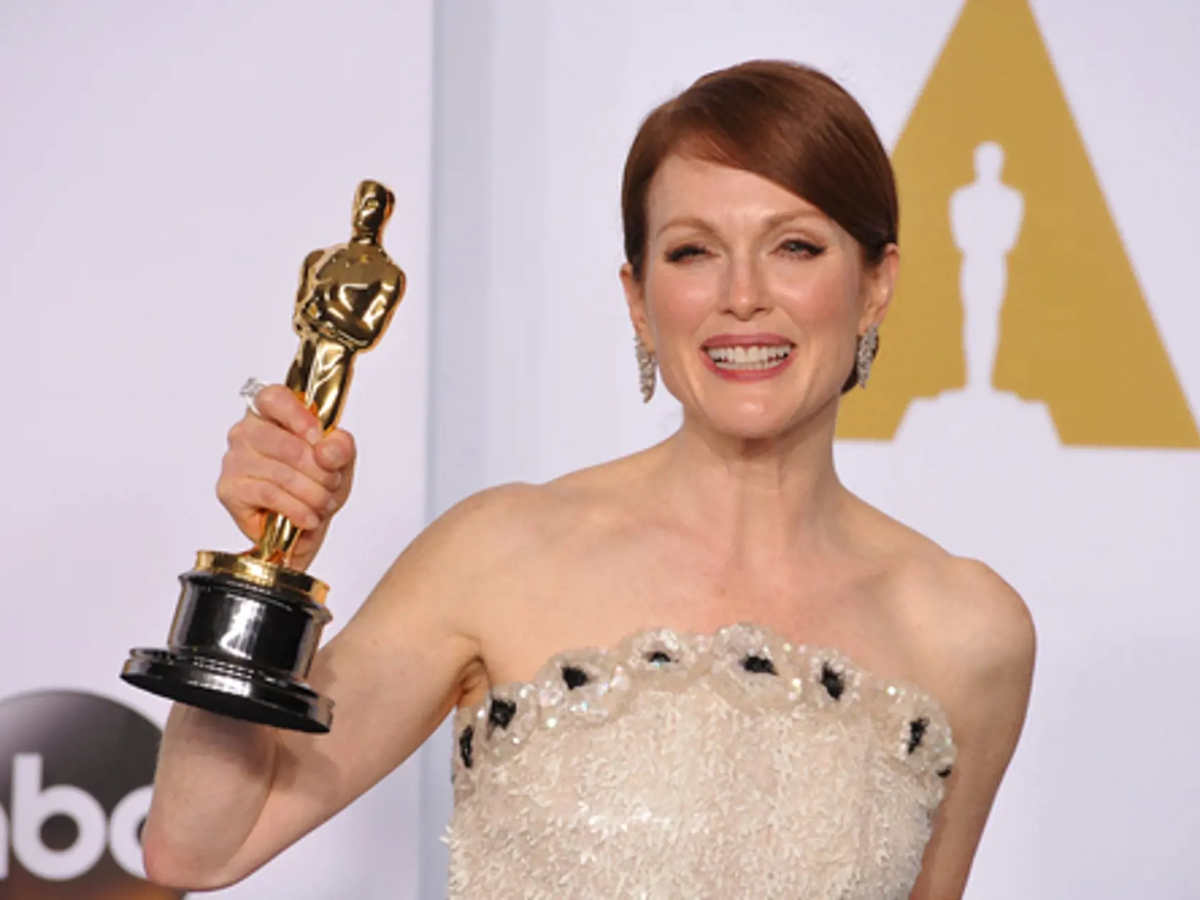  Veď čo môže byť pre návrhára väčšou reklamou, ako jeho róba na červenom koberci? Julianne Moore získala sošku v roku 2015. 