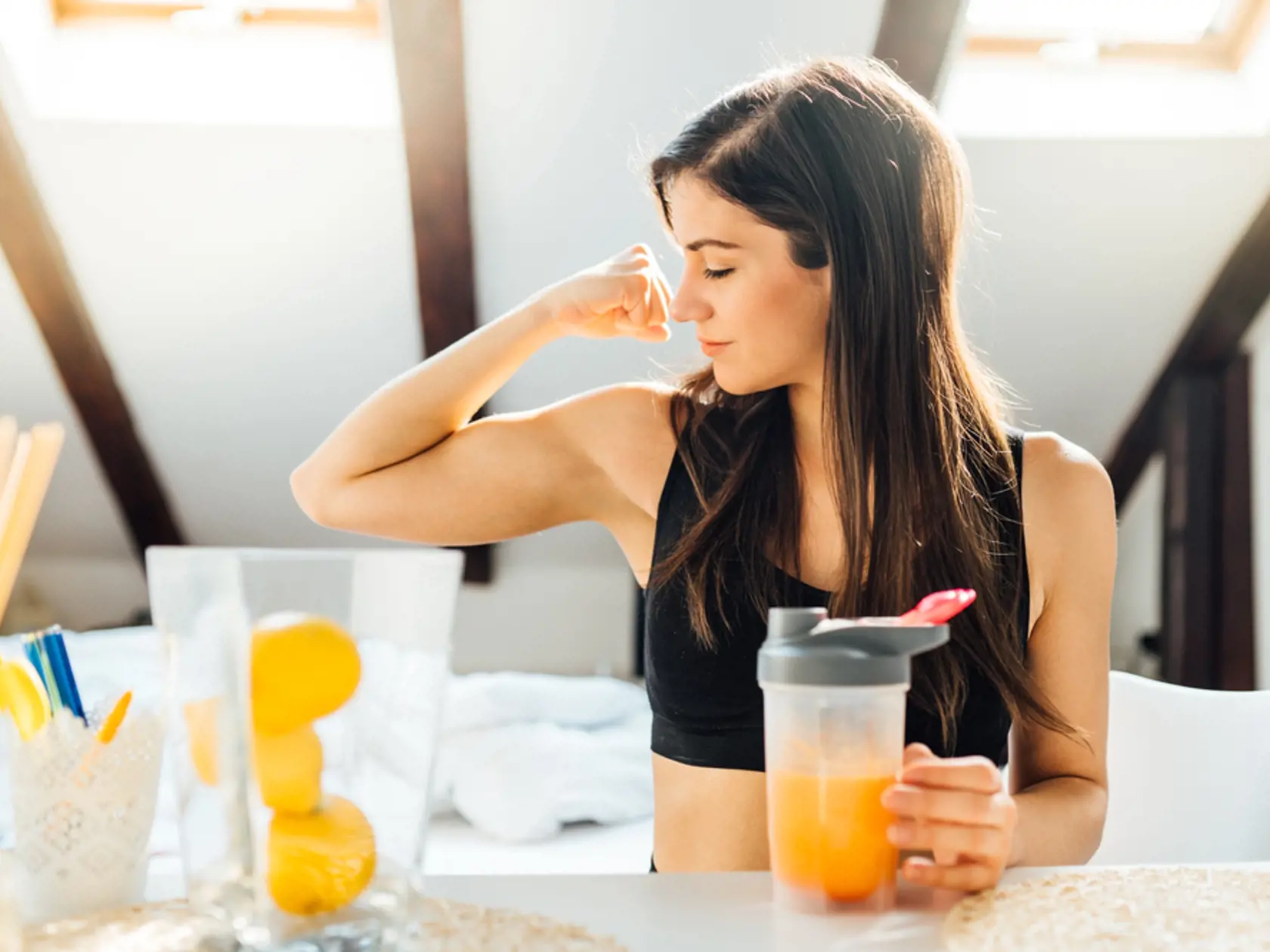 Woman,At,Home,Drinking,Orange,Flavored,Amino,Acid,Vitamin,Powder.keto
