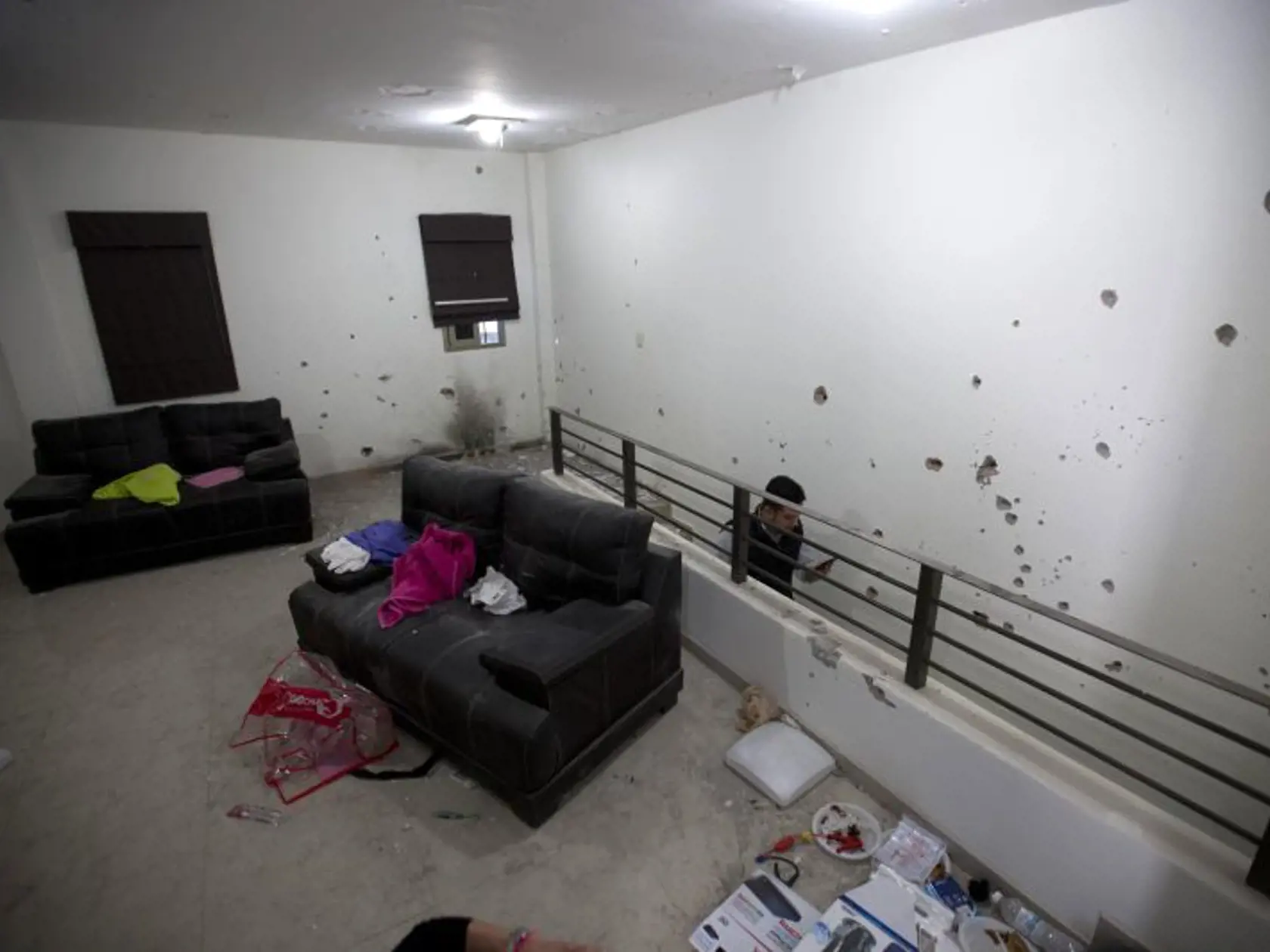 Bullet holes riddle the walls of the second floor of the home that marines raided in the search for Mexican drug lord Joaquin “El Chapo” Guzman in Los Mochis, Mexico, Monday, Jan. 11, 2016. On Friday, Guzman and his security chief traveled several blocks through the city's storm sewer system, accessed under the home, before popping out in the middle of an intersection. Federal police eventually found them on a highway outside of town, ending Guzman’s flight six months after his escape from the s