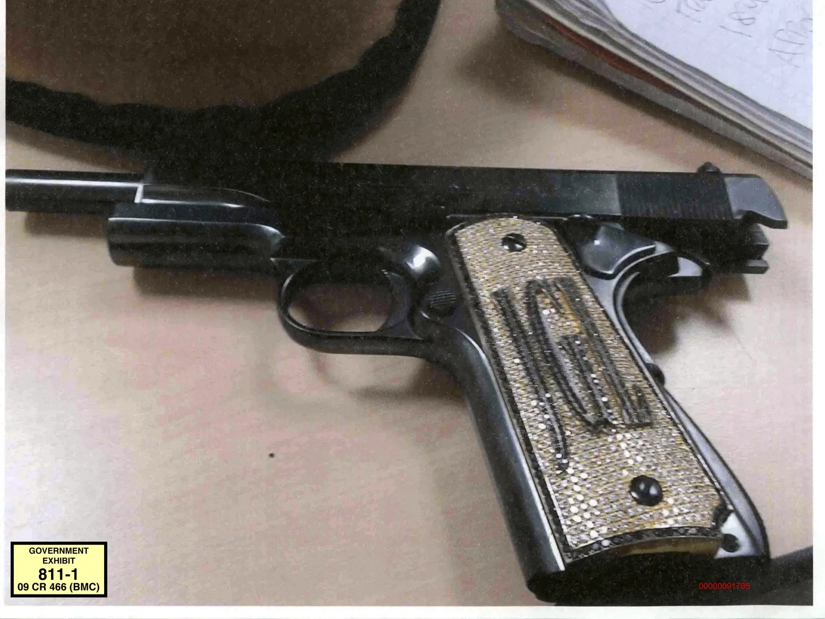 FILE - This undated file photo provided by the U.S. Attorney's Office shows a diamond-encrusted pistol that a government witness said belonged to infamous Mexican drug lord Joaquin "El Chapo" Guzman, at Guzman's trial in New York. After El Chapoâ€™s conviction in the drug-trafficking trial that included florid testimony of jewel-encrusted guns, some Americans have floated an idea they see as poetic justice: Why not take some of the Mexican drug lordâ€™s billions in ill-gotten gains and make him 