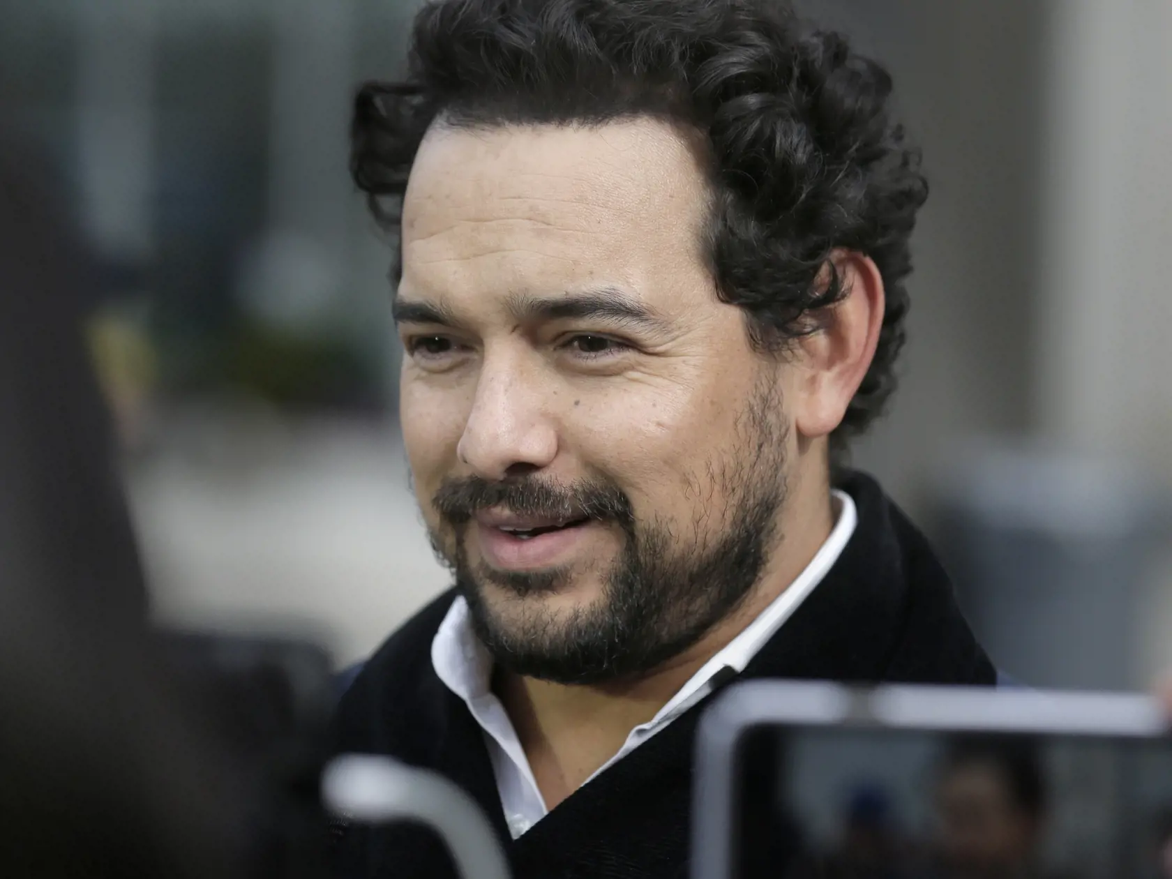 Actor Alejandro Edda talks to reporters outside federal court in the Brooklyn borough of New York, Monday, Jan. 28, 2019. The actor, who portrayed the notorious drug lord El Chapo on a Netflix series, appeared at the kingpin's trial. (AP Photo/Seth Wenig)