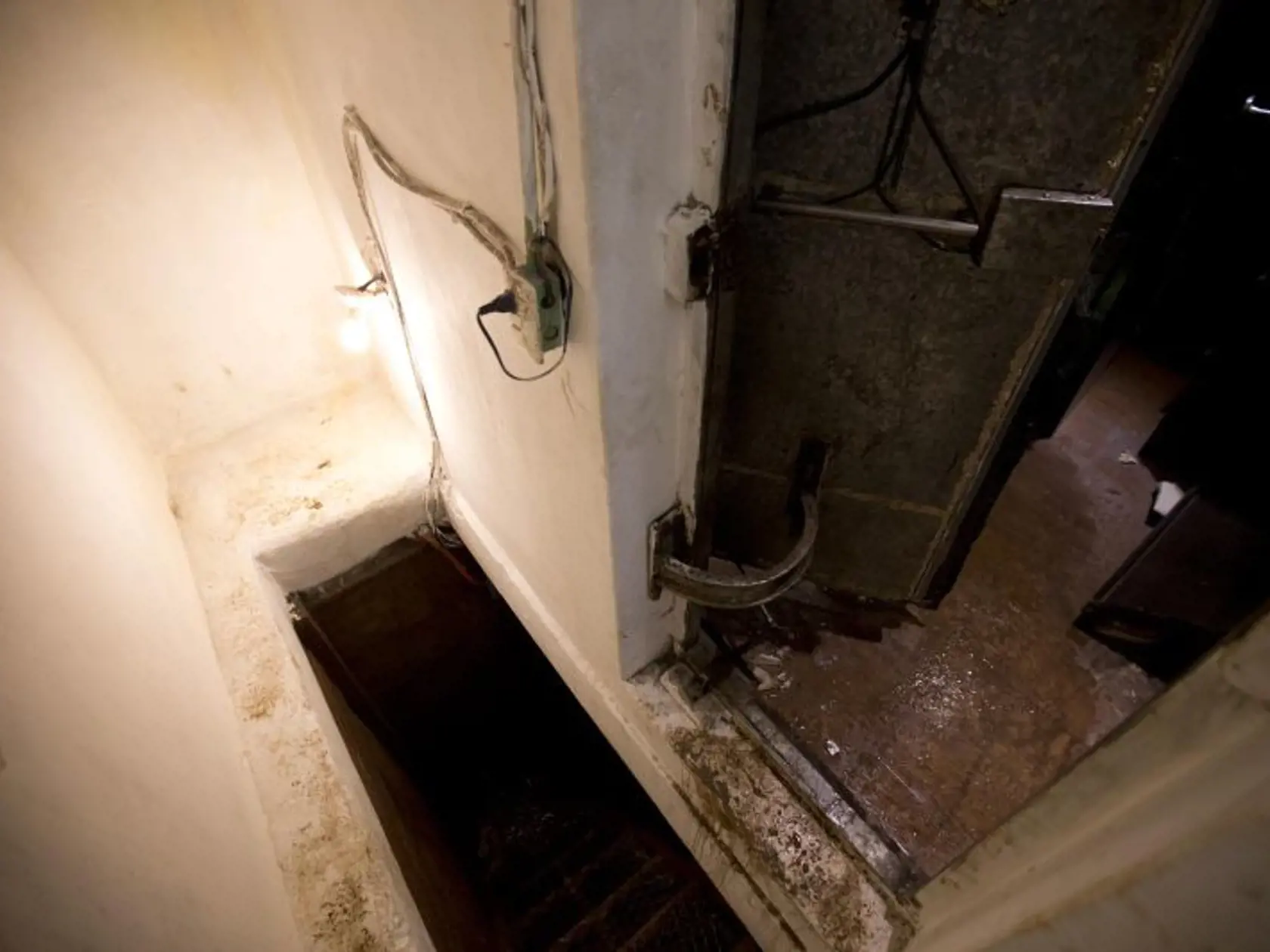 The entrance to a tunnel, hidden behind a closet mirror on the ground floor, lays open under the home where marines searched for Mexican drug lord Joaquin “El Chapo” Guzman in Los Mochis, Mexico, Monday, Jan. 11, 2016. On Friday, Guzman and his security chief traveled several blocks through the city's storm sewer system, accessed under the home, before popping out in the middle of an intersection. Federal police eventually found them on a highway outside of town and Guzman’s flight ended six mon