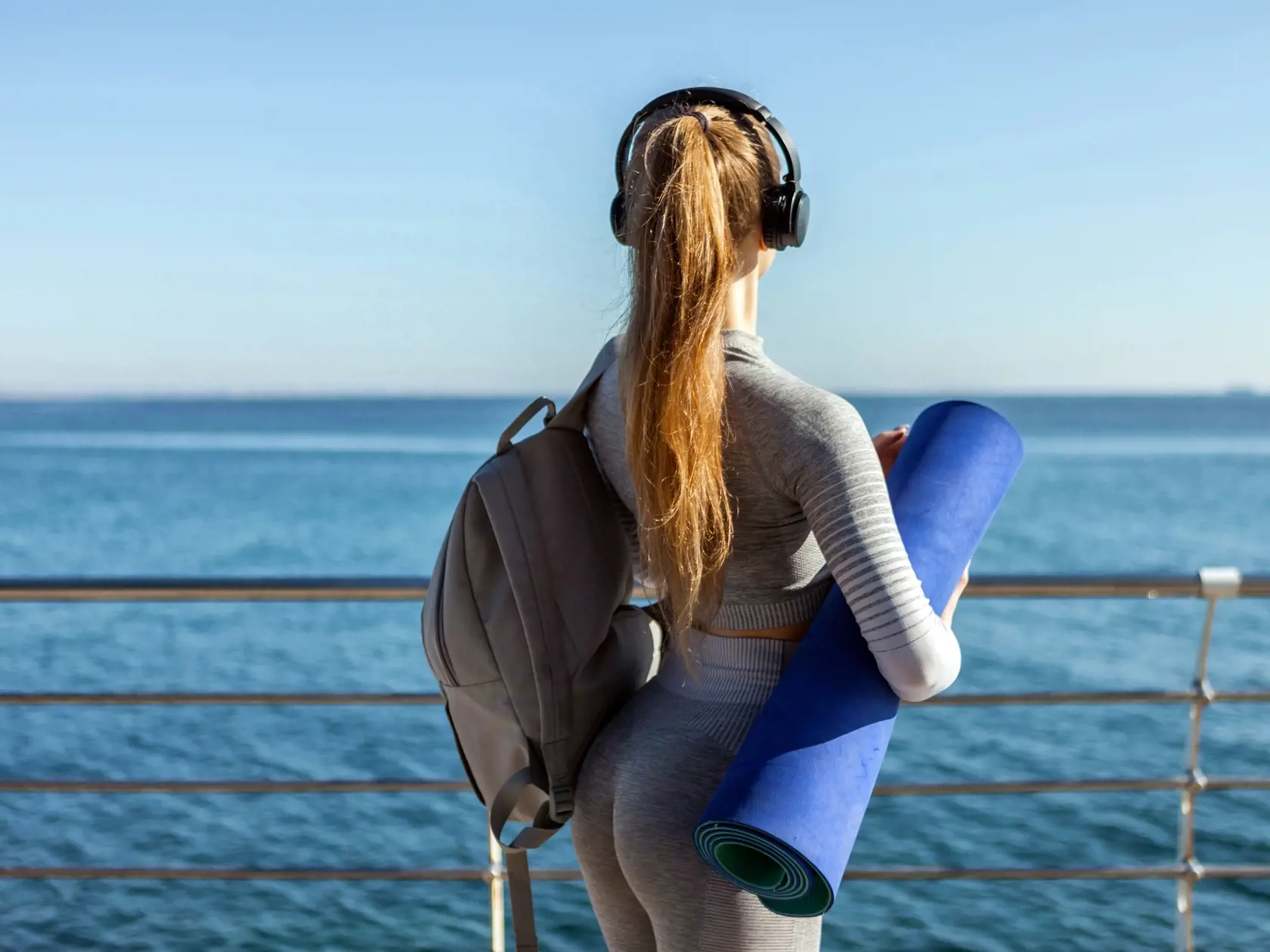 Active,Caucasian,Fit,Woman,Listening,To,Music,With,Headphones,And