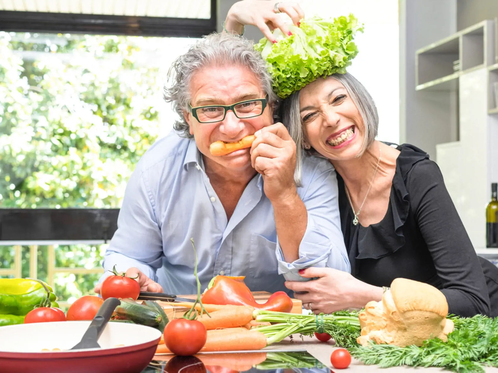 Senior,Couple,Having,Fun,In,Kitchen,With,Healthy,Food,-