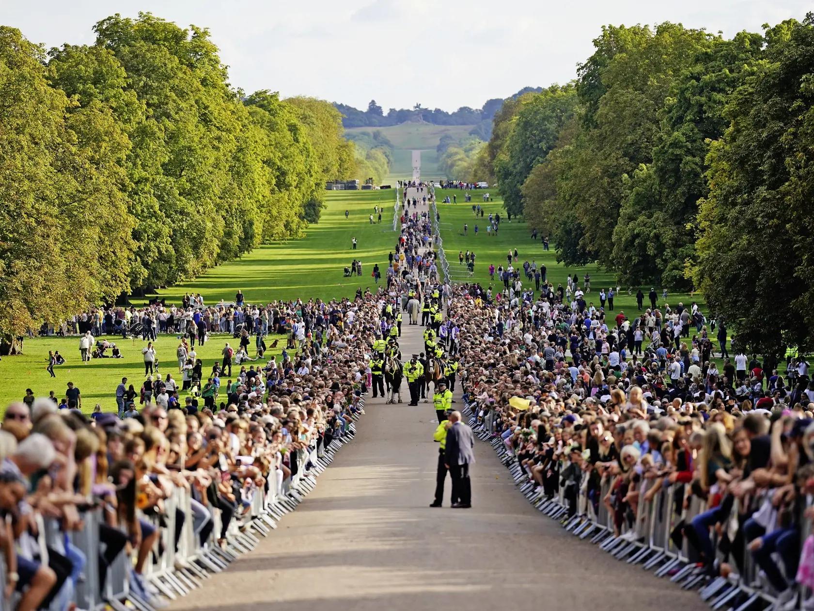WINDSOR, ENGLAND - SEPTEMBER 10: Crowds gather to meet Catherine, Princess of Wales, Prince William, Prince of Wales, Meghan, Duchess of Sussex and Prince Harry, Duke of Sussex on the long Walk at Windsor Castle on September 10, 2022 in Windsor, England. Crowds have gathered and tributes left at the gates of Windsor Castle to Queen Elizabeth II, who died at Balmoral Castle on 8 September, 2022. (Photo by Kirsty O'Connor - WPA Pool/Getty Images)