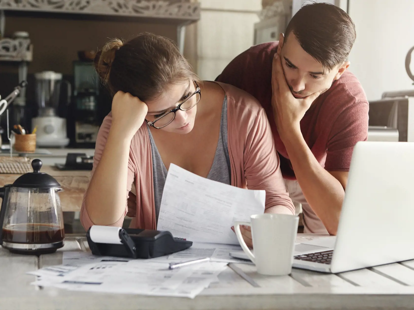 Young,Stressed,Caucasian,Couple,Facing,Financials,Troubles,,Sitting,At,Kitchen