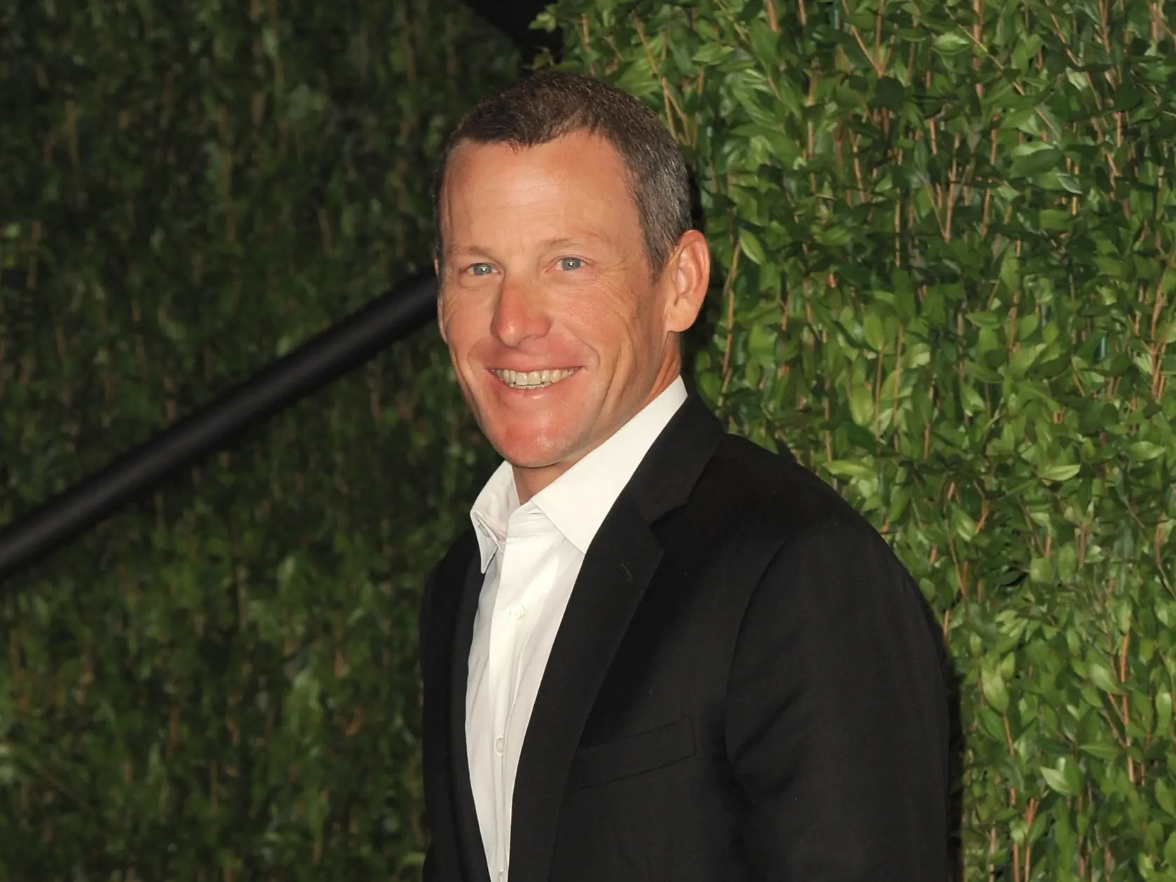 FILE - In this Feb. 26, 2012 file photo, Lance Armstrong arrives at the 2012 Vanity Fair Oscar Party Hosted By Graydon Carter held at Sunset Tower, in West Hollywood, Calif.   Companies take a risk when tying their names to real-life people they have little control over. After the U.S. Anti-Doping Agency released a report detailing allegations of doping by Armstrong, the once celebrated cancer survivor saw his sponsorship deals vanish. Nike, Anheuser-Busch, 24 Hour Fitness and Trek Bicycle were 