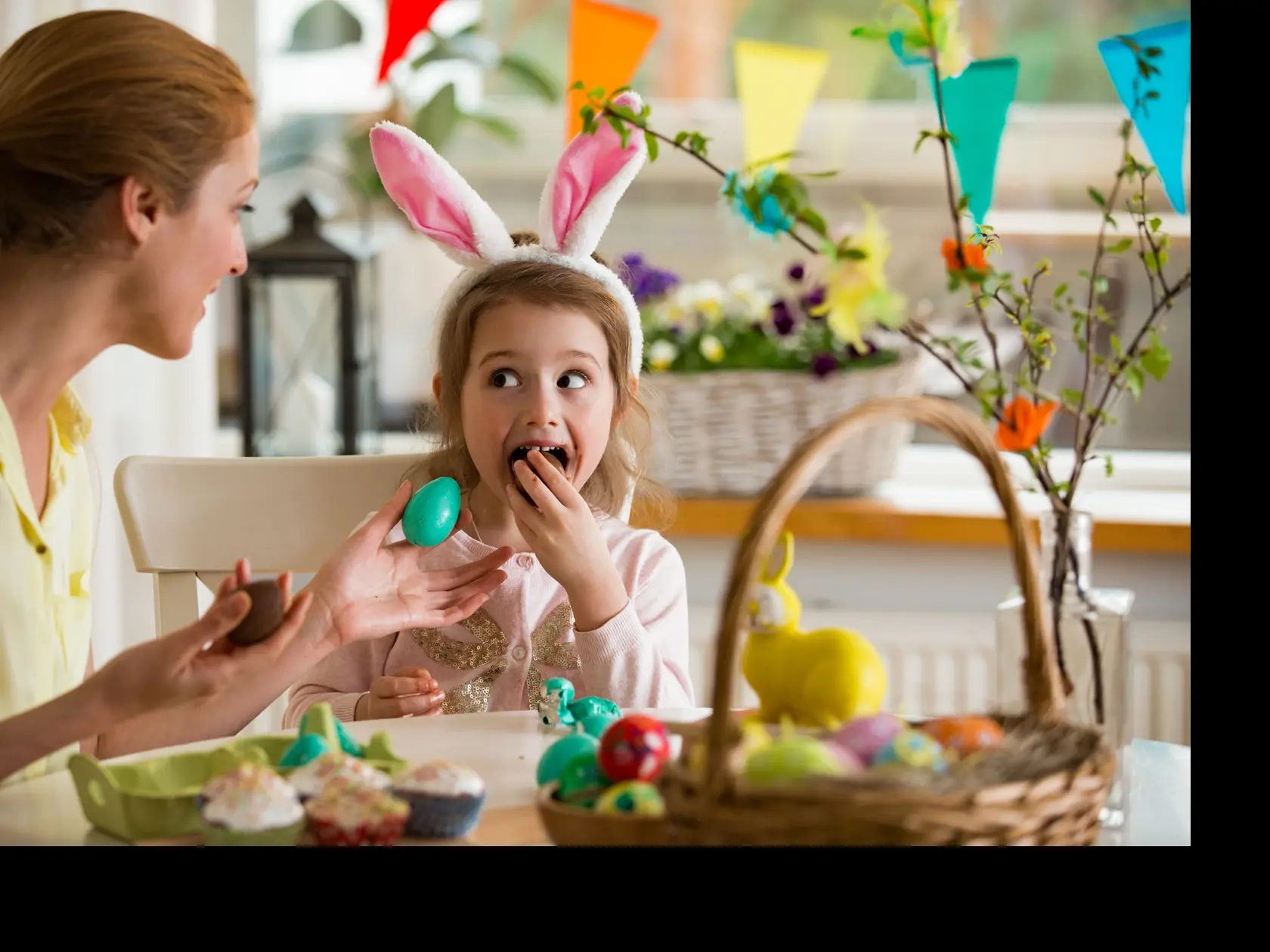 Mother,And,Daughter,Celebrating,Easter,,Eating,Chocolate,Eggs.,Happy,Family