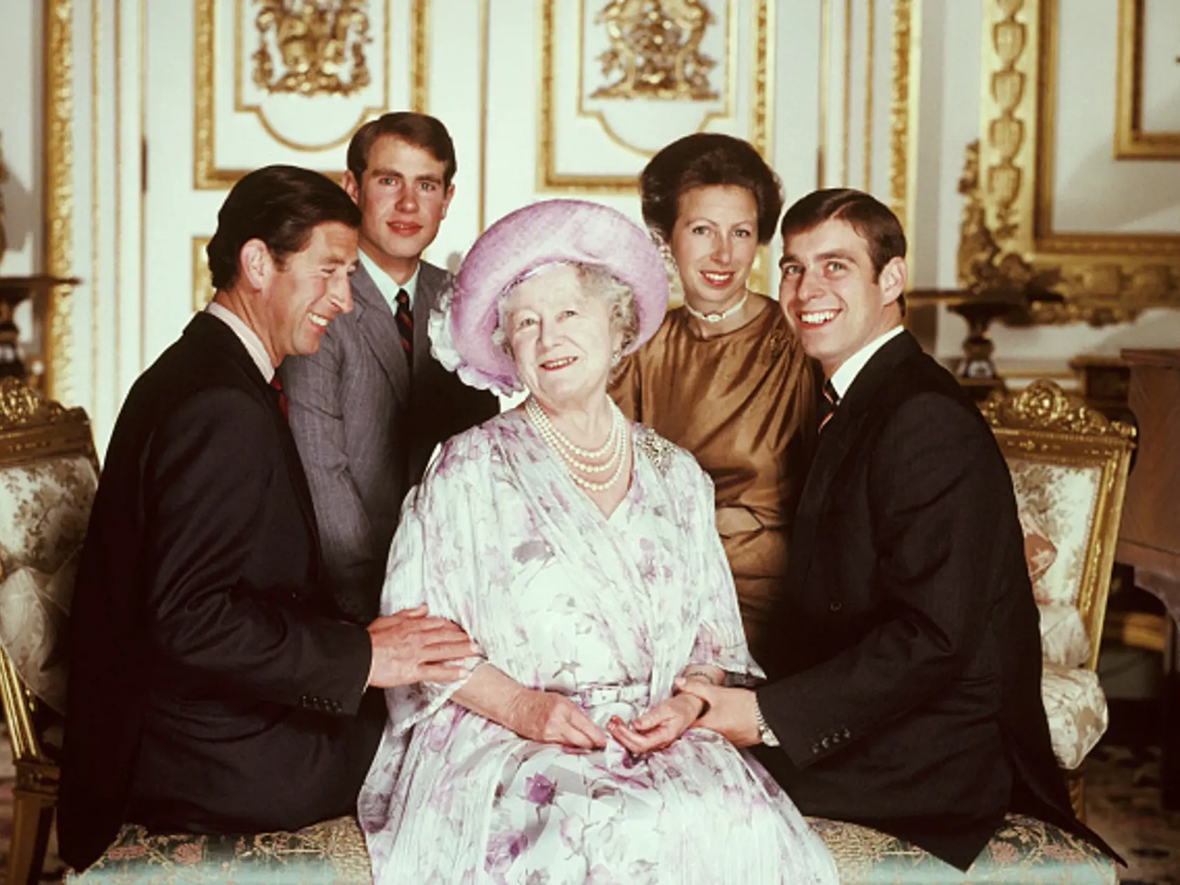 "Queen Elizabeth the Queen Mother of the United Kingdom, with her grand-children, Charles, Prince of Wales, Prince Edward, Earl of Wessex, Anne, Princess Royal, and Prince Andrew, Duke of York, children of Queen Elisabeth II. (Photo by © Norman Parkinson Achive/Iconic Images/Getty Images)"