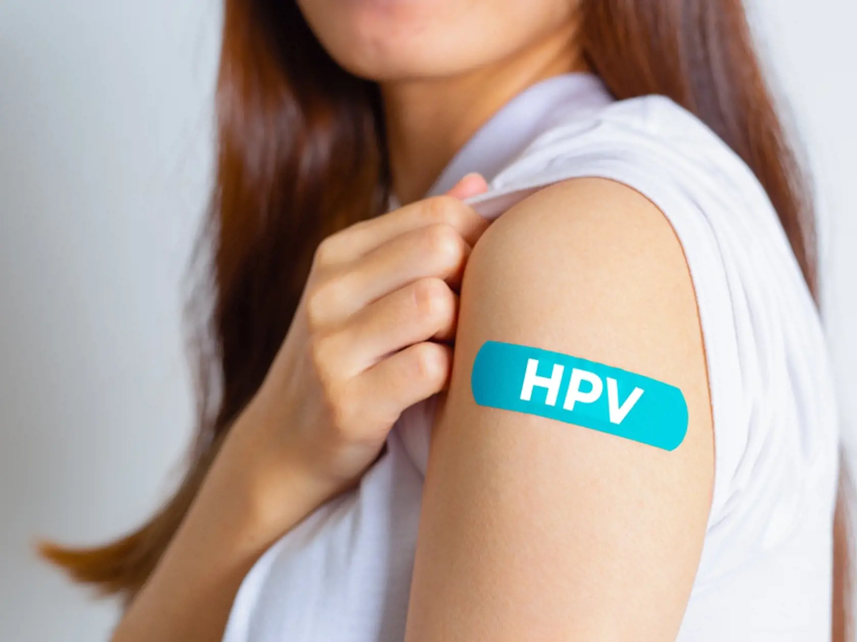 Hpv,(human,Papillomavirus),Teenager,Woman,Showing,Off,An,Blue,Bandage