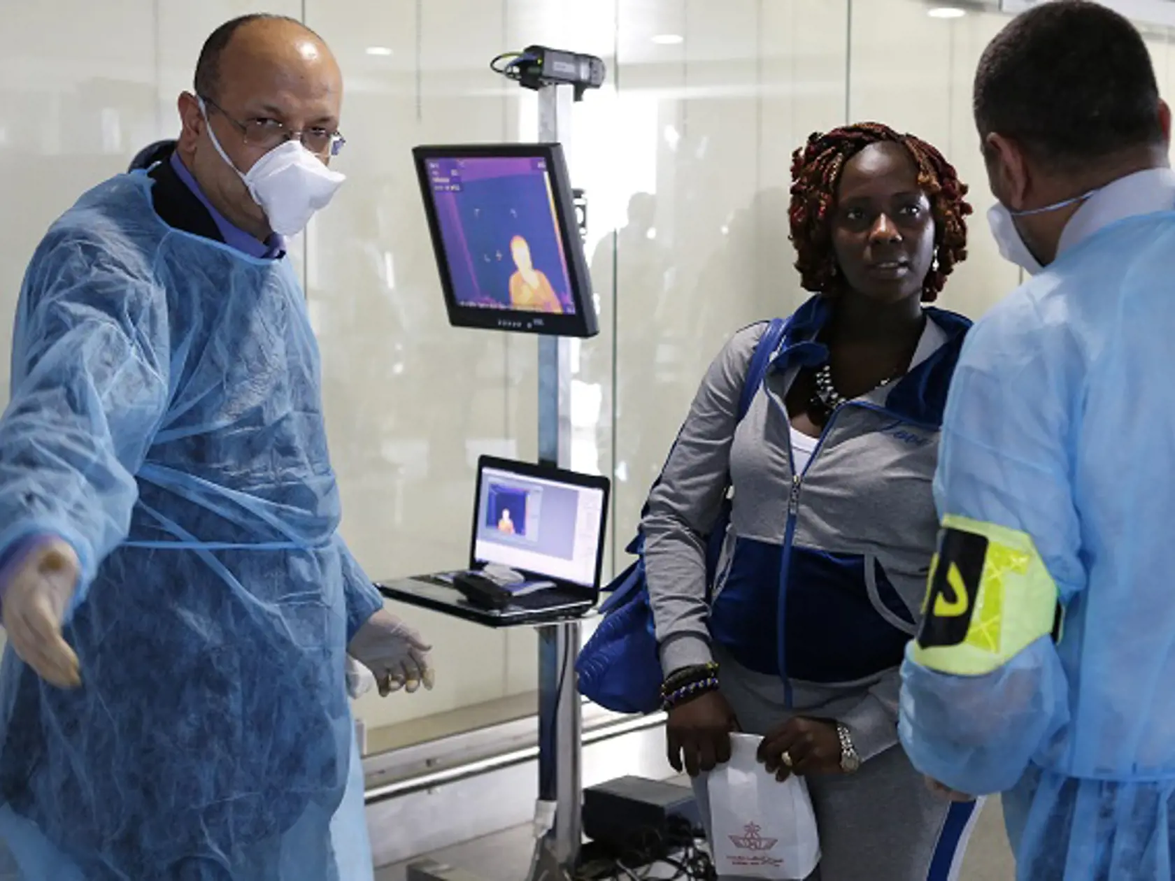 Moroccan health workers screen passengers at the arrivals hall of the Mohammed V airport in Casablanca, Thursday, Oct 9, 2014. Air Maroc, along with Air France and Brussels Airlines, are still flying to Ebola-hit West Africa, with the backing of the World Health Organization. The WHO has urged the airlines to keep flying, saying the risk to public health from air travel itself is low and that flights bring needed aid workers and supplies. Airlines have to balance that against safety concerns whi