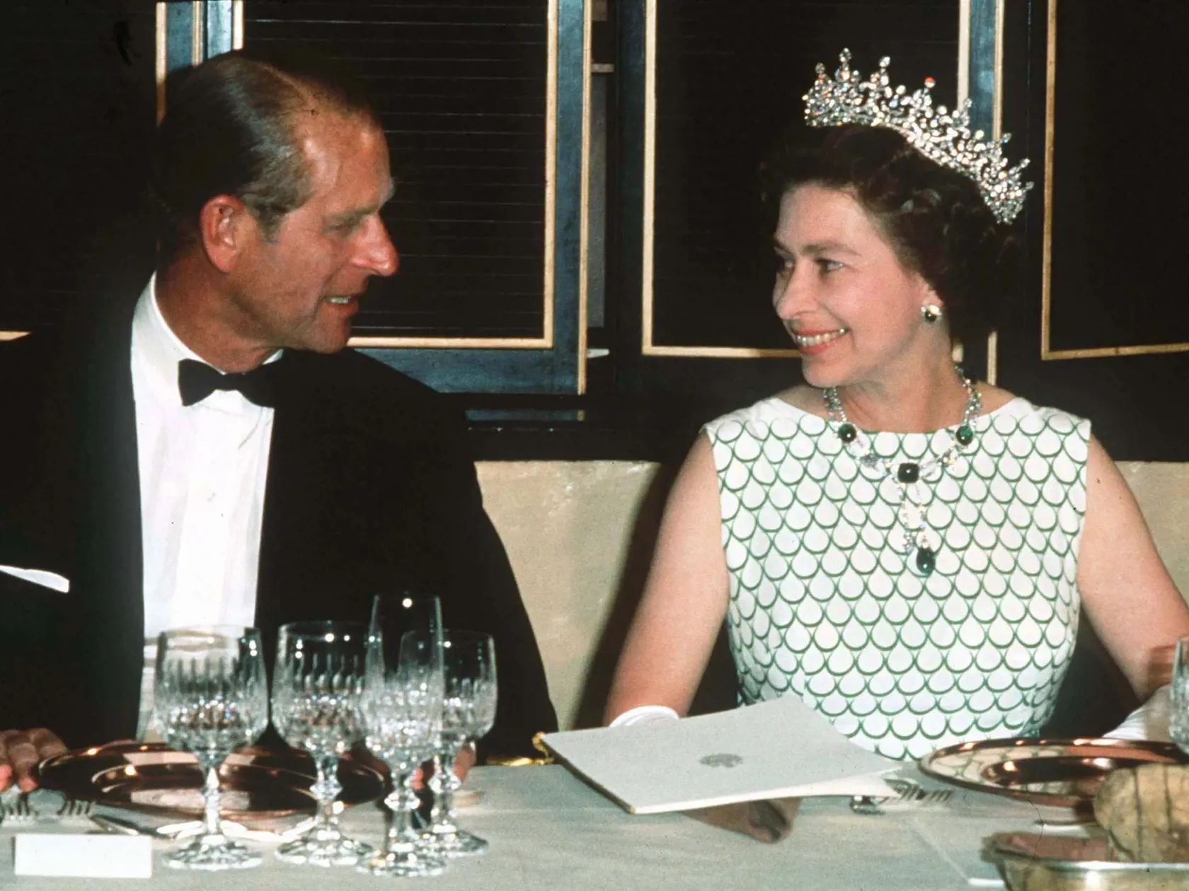 LOCATION UKNOWN - 1970: Queen Elizabeth II and Prince Philip, the Duke of Edinburgh at a State banquet in 1970. (Photo by Anwar Hussein/Getty Images)
