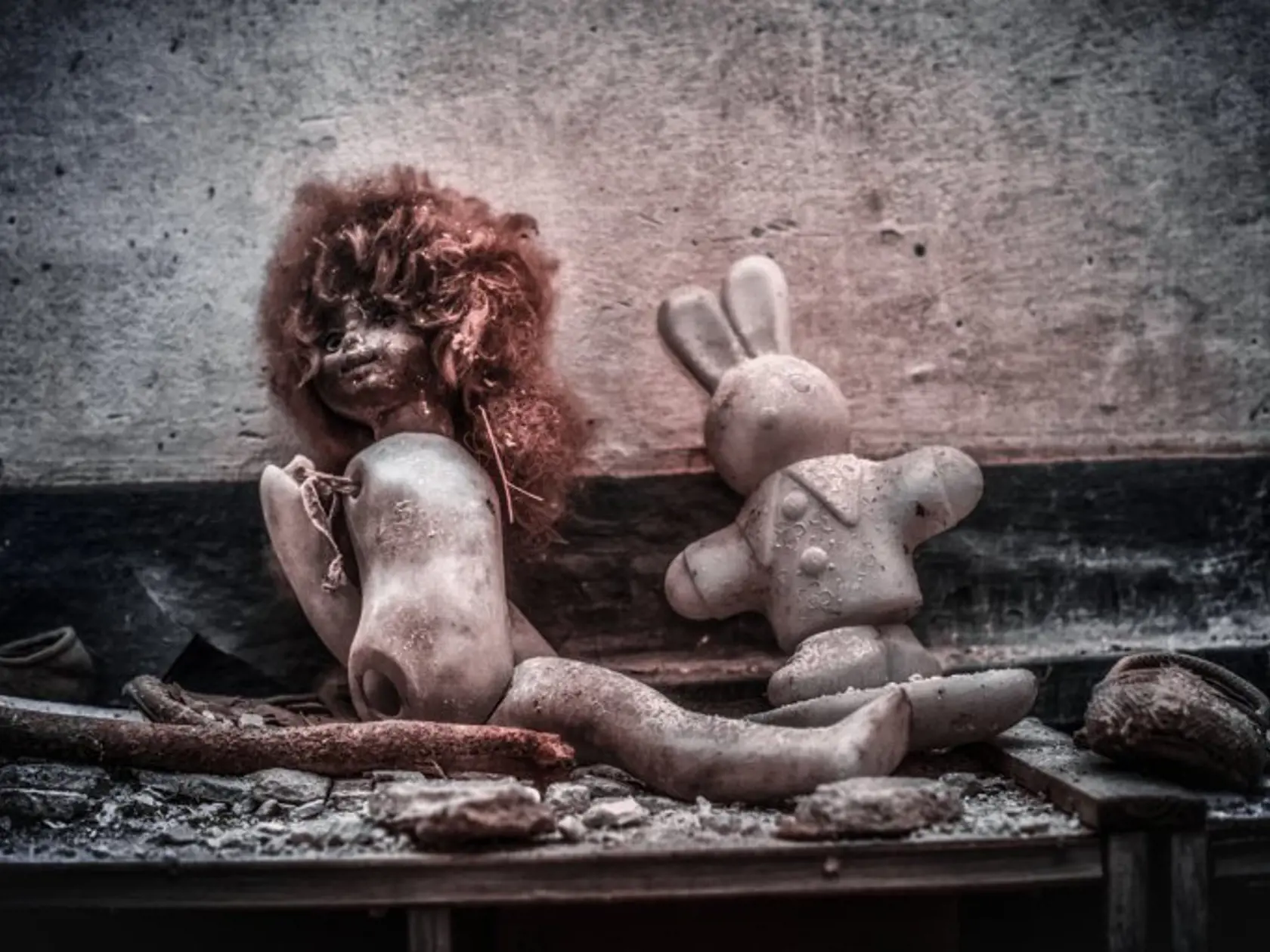 *MANDATORY PICTURE CREDIT* PIC BY VLADIMIR MIGUTIN / CATERS - (Pictured: Toys in the infant school in Pripyat) - This fascinating photo series looks to show the bleak isolation of Chernobyl like never before, with all of the images featured shot using INFRARED FILTERS. Such a technique allowed photographer Vladimir Mitgutin to bring out the finite details in the likes of abandoned buses, radar systems and homes, as the red hues make them pop out against the icy backdrops. Vladimir, 32, recently 