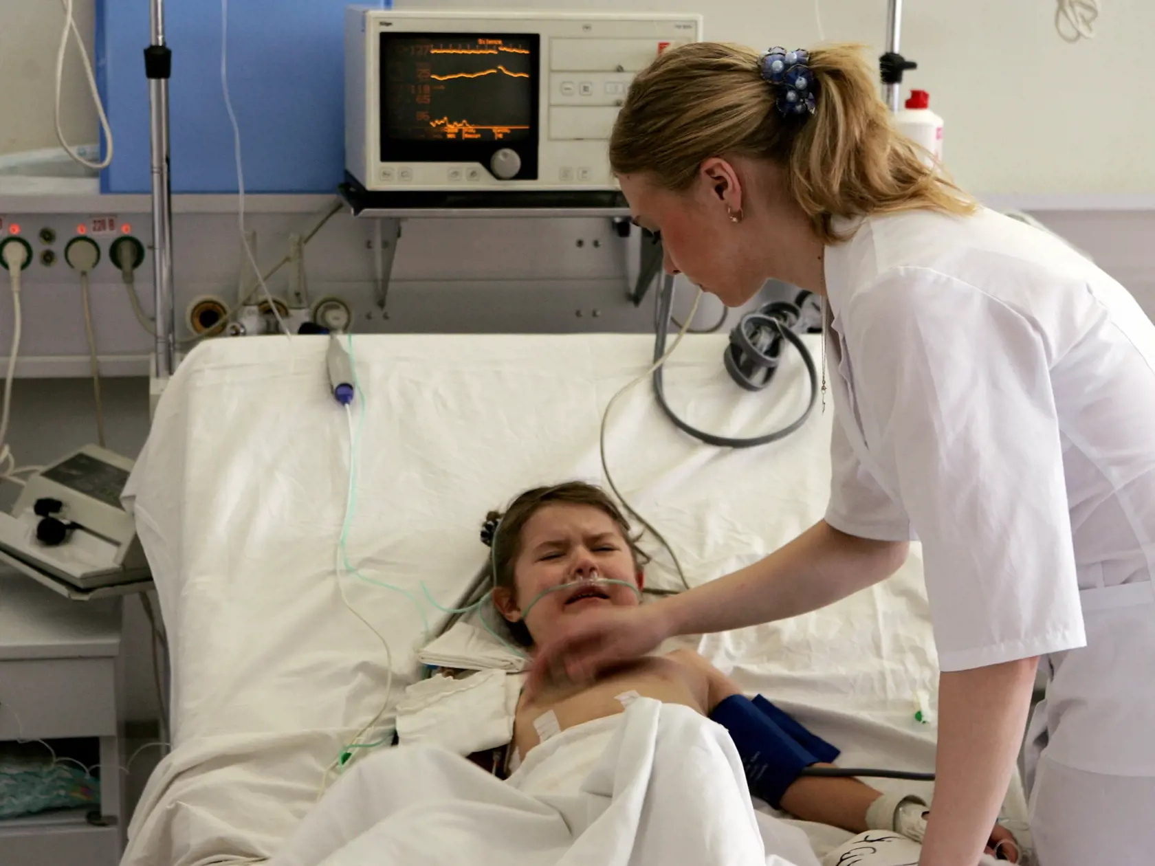 MINSK, BELARUS - MARCH 14: 7-year-old Svetlana lies in bed at the intensive care unit in the Children's Surgical Center on March 14, 2006 in Minsk, Belarus. Svetlana suffers from portal hypertension. Portal hypertension is an increase in the pressure within the portal vein (the vein that carries blood from the digestive organs to the liver). The increase in pressure is caused by a blockage in the blood flow through the liver.  On April 26, 1986, reactor number four at the Chernobyl Nuclear Power