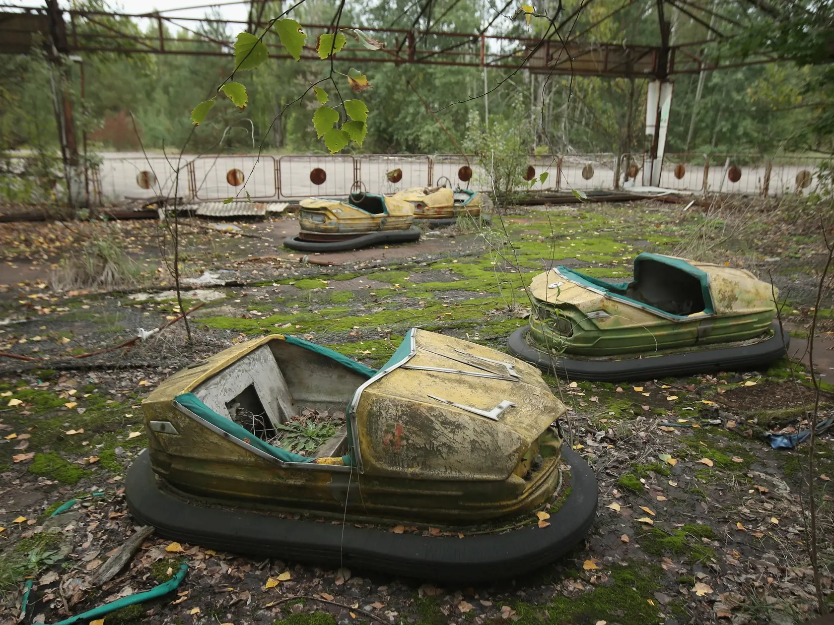 PRIPYAT, UKRAINE - SEPTEMBER 29:  Bumper cars stand in an abandoned amusement park on September 29, 2015 in Pripyat, Ukraine. Pripyat lies only a few kilometers from the former Chernobyl nuclear power plant and was built in the 1970s to house the plant's workers and their families. On April 26, 1986, technicians at Chernobyl conducting a test inadvertently caused reactor number four to explode, sending plumes of highly radioactive particles and debris into the atmosphere. Authorities evacuated 1