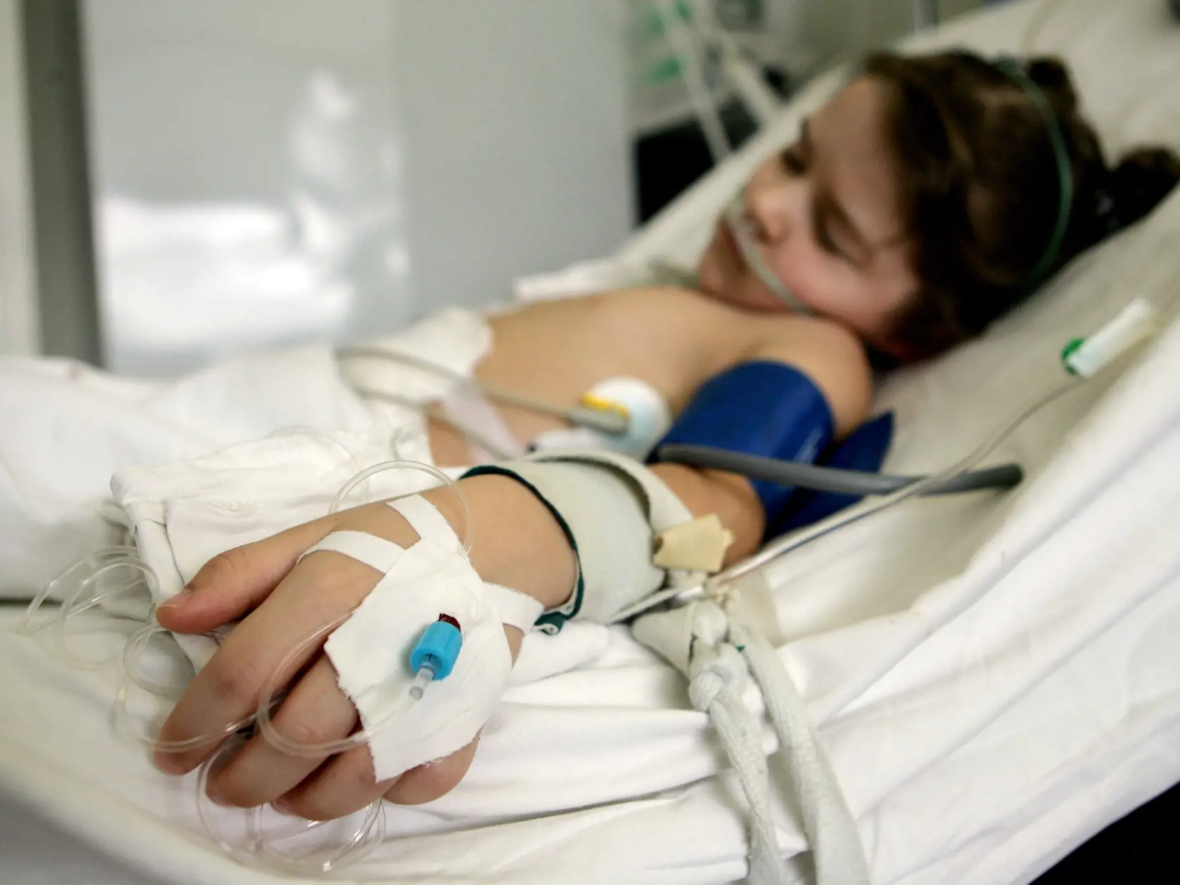MINSK, BELARUS - MARCH 14: 7-year-old Svetlana lies in bed at the intensive care unit in the Children's Surgical Center on March 14, 2006 in Minsk, Belarus. Svetlana suffers from portal hypertension. Portal hypertension is an increase in the pressure within the portal vein (the vein that carries blood from the digestive organs to the liver). The increase in pressure is caused by a blockage in the blood flow through the liver.  On April 26, 1986, reactor number four at the Chernobyl Nuclear Power
