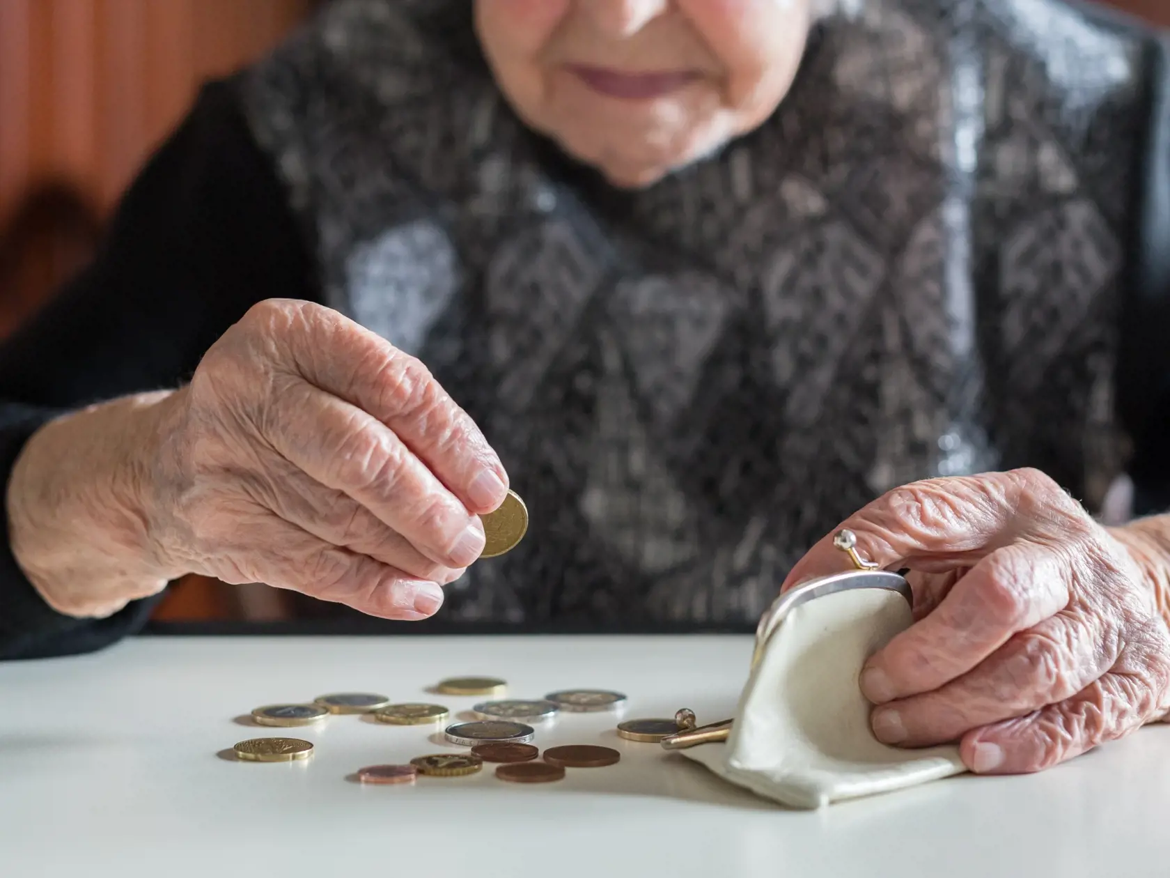 Elderly,95,Years,Old,Woman,Sitting,Miserably,At,The,Table