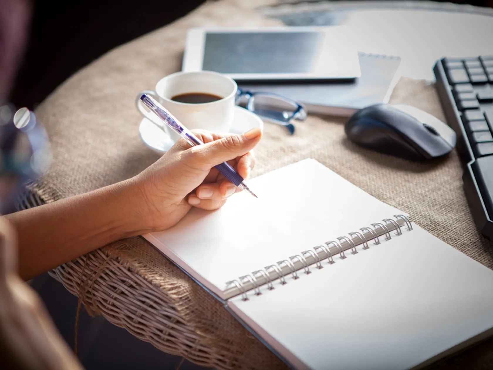 Woman,Left,Hand,Writing,On,Paper,Book,,on,Table,Shot