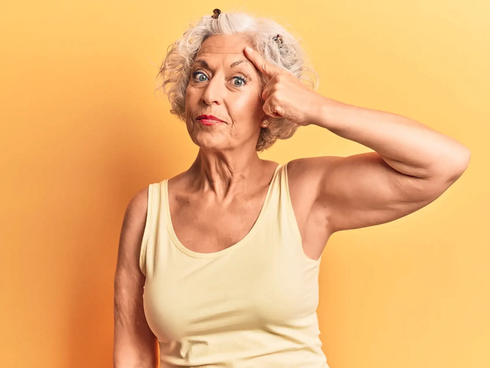 Senior,Grey-haired,Woman,Wearing,Casual,Clothes,Pointing,Unhappy,To,Pimple