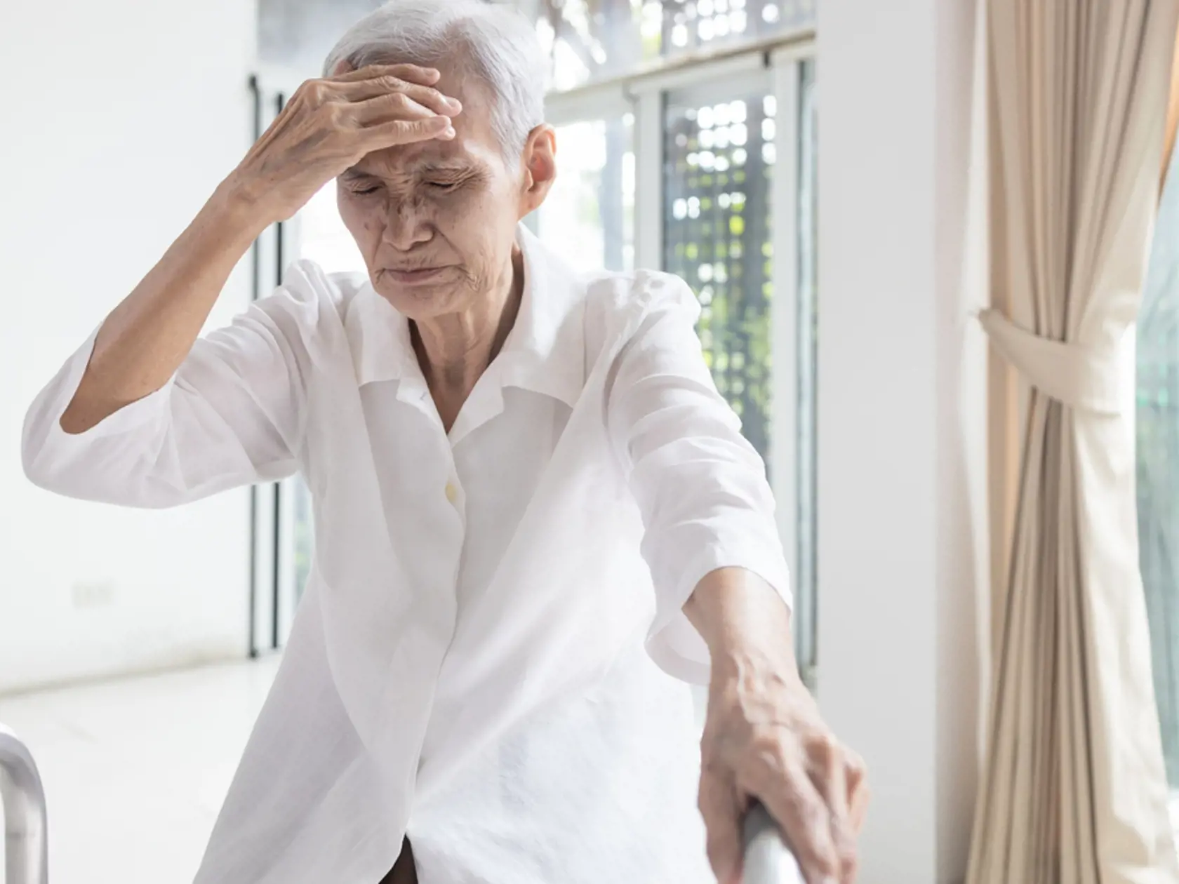 Exhausted,Asian,Senior,Woman,Is,Touching,Her,Head,With,Hand,symptoms