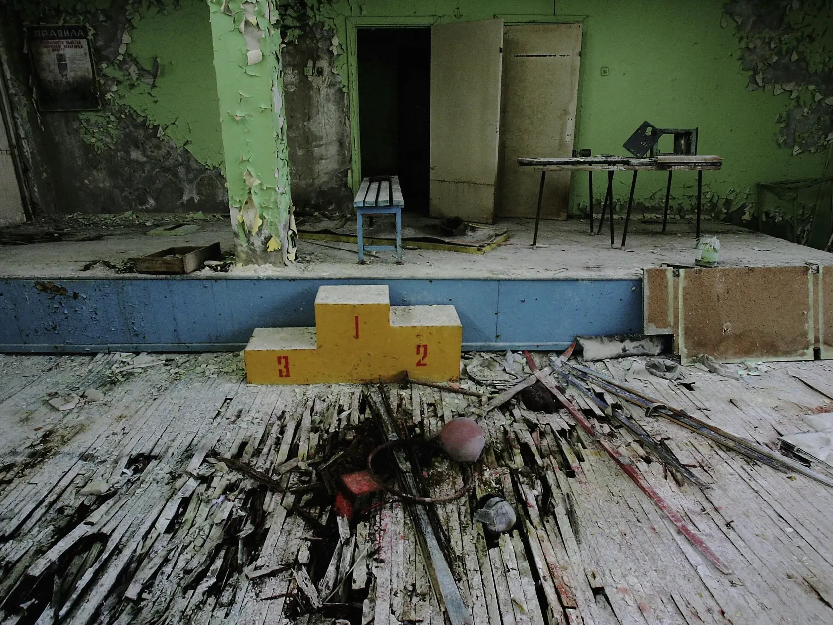CHERNOBYL - JANUARY 25: A podium lays in the middle of an abandoned school gymnasium in the city of Pripyat on January 25, 2006 near Chernobyl, Ukraine.Prypyat and the surrounding area will not be safe for human habitation for several centuries. Scientists estimate that the most dangerous radioactive elements will take up to 900 years to decay sufficiently to render the area safe.   (Photo by Daniel Berehulak/Getty Images)
