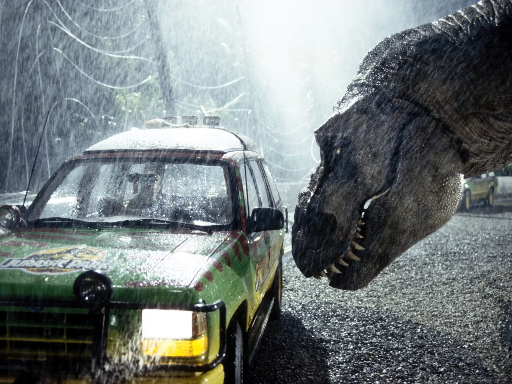 A tyrannosaurus rex terrorizes people trapped in a car in a scene from the 1993 American film Jurassic Park directed by Steven Spielberg. The sci-fi adventure stars Sam Neill, Laura Dern, and Jeff Goldblum. The film is an adaptation of Michael Crichton's novel of the same name. (Photo by Murray Close/Sygma/Sygma via Getty Images)