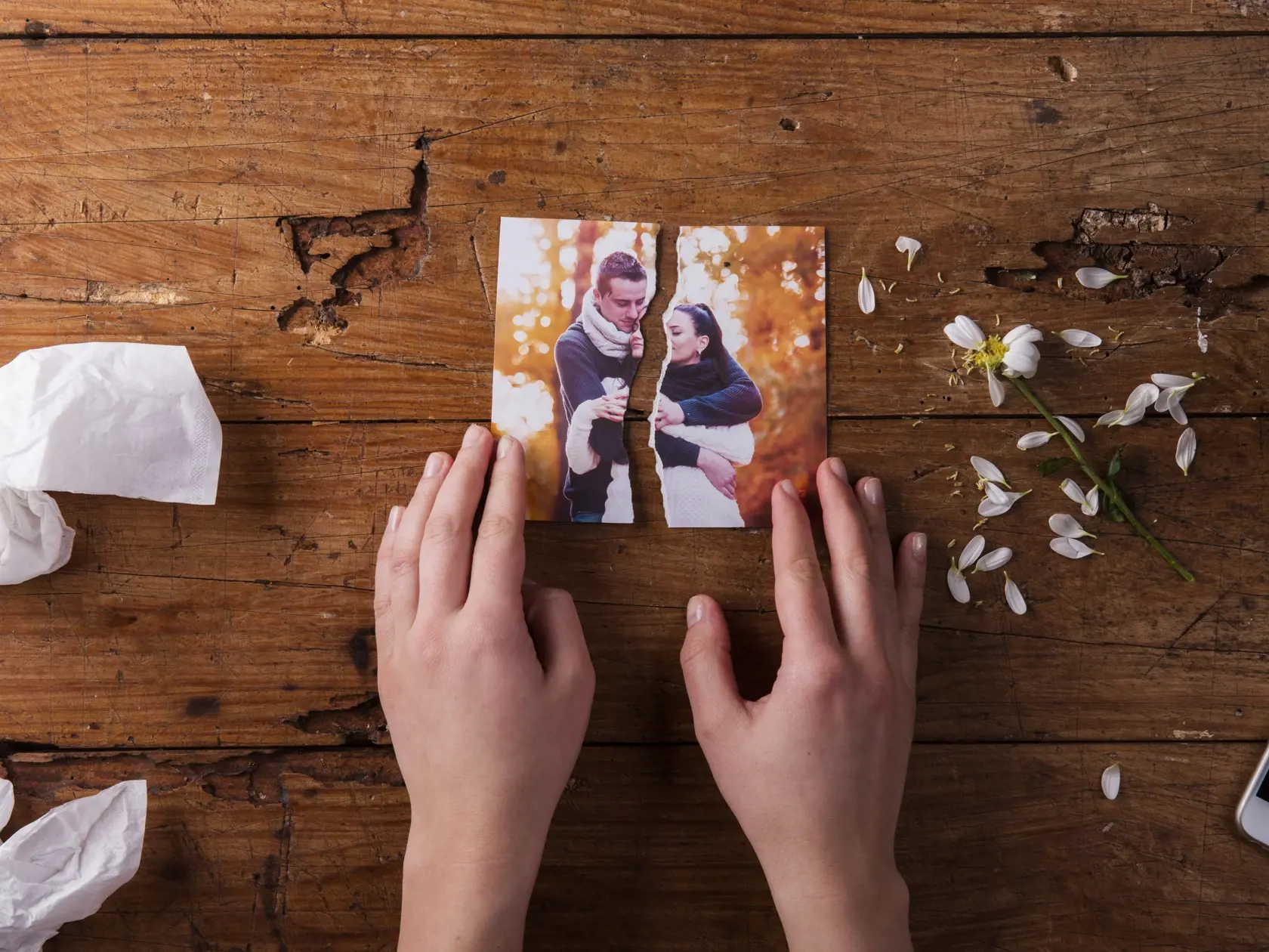 Unrecognizable,Sad,Woman,Holding,Torn,Picture,Of,Couple,In,Love.