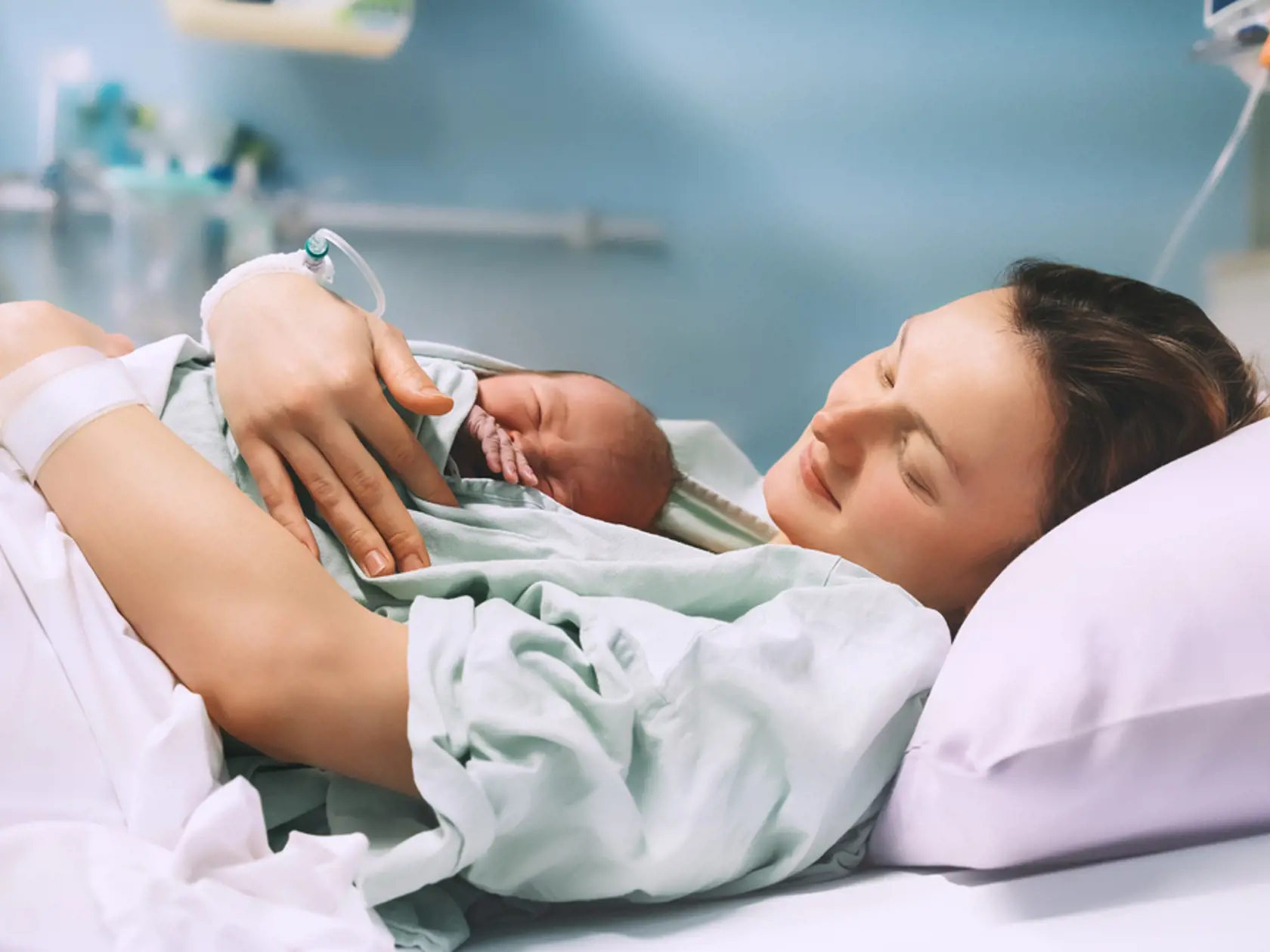 Mother,And,Newborn.,Child,Birth,In,Maternity,Hospital.,Young,Mom
