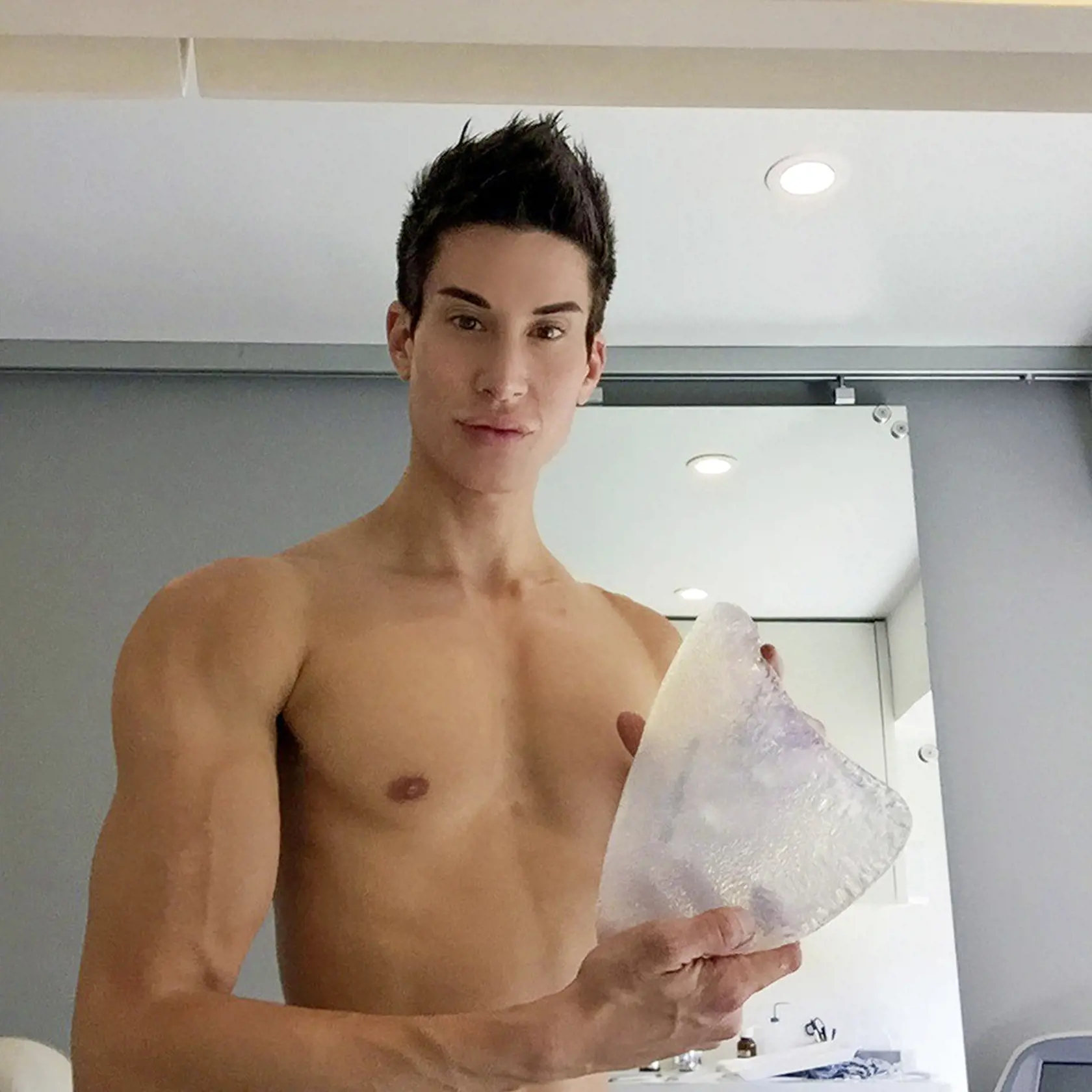 - (PICTURED: Justin is a specialist custom implant designer and designed the worlds first custom thigh implants - her he is with one implant) - A Human Ken Doll has created the worlds first custom-designed THIGH implants for a fitness instructor who wanted thicker legs. Having spent 500,000USD on more than 490 cosmetic procedures, Justin Jedlica, 36, from Beverley Hill, in California, USA, is now designing the perfect body for others. He created the bespoke thigh implants for an unnamed female w