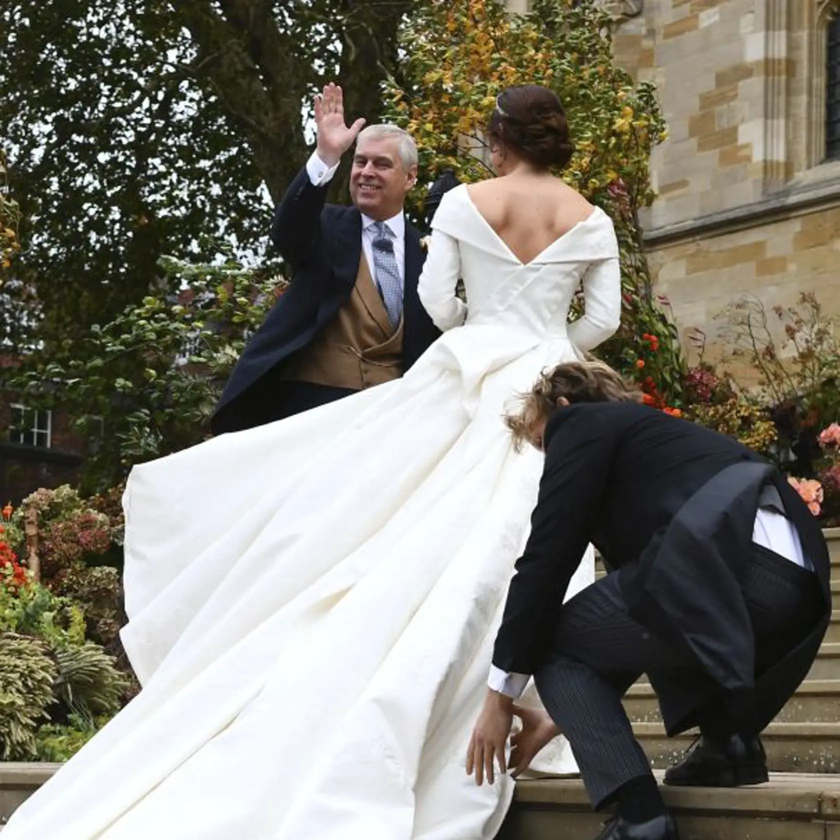 Britain's Princess Eugenie arrives with her father Prince Andrew for her wedding to Jack Brooksbank at St Georgeâs Chapel, Windsor Castle, near London, England, Friday Oct. 12, 2018. (Victoria Jones/Pool via AP)