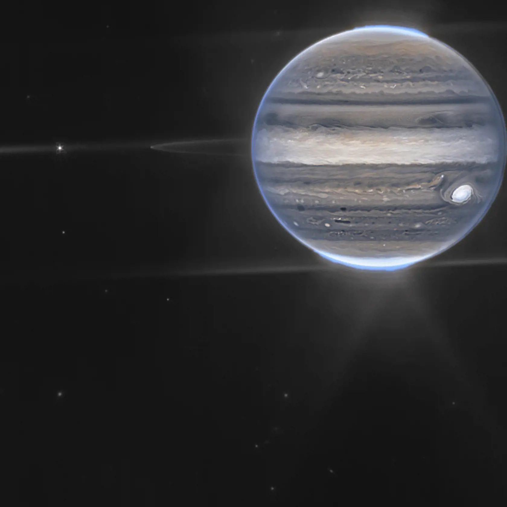 Táto snímka poskytnutá NASA ukazuje zložený obrázok Jupitera vo falošných farbách získaný vesmírnym teleskopom Jamesa Webba 27. júla 2022. Prstence planéty a niektoré z jej malých satelitov sú viditeľné spolu s galaxiami v pozadí.