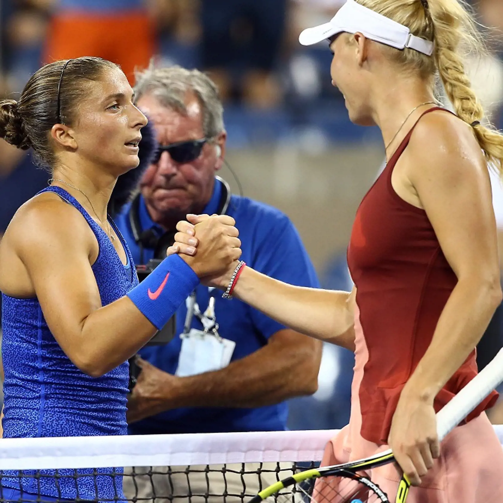 NEW YORK, NY - SEPTEMBER 02:  Caroline Wozniacki (R) of Denmark shakes hands with Sara Errani (L) of Italy in their women's singles quarterfinal match on Day Nine of the 2014 US Open at the USTA Billie Jean King National Tennis Center on September 2, 2014 in the Flushing neighborhood of the Queens borough of New York City.  (Photo by Streeter Lecka/Getty Images)