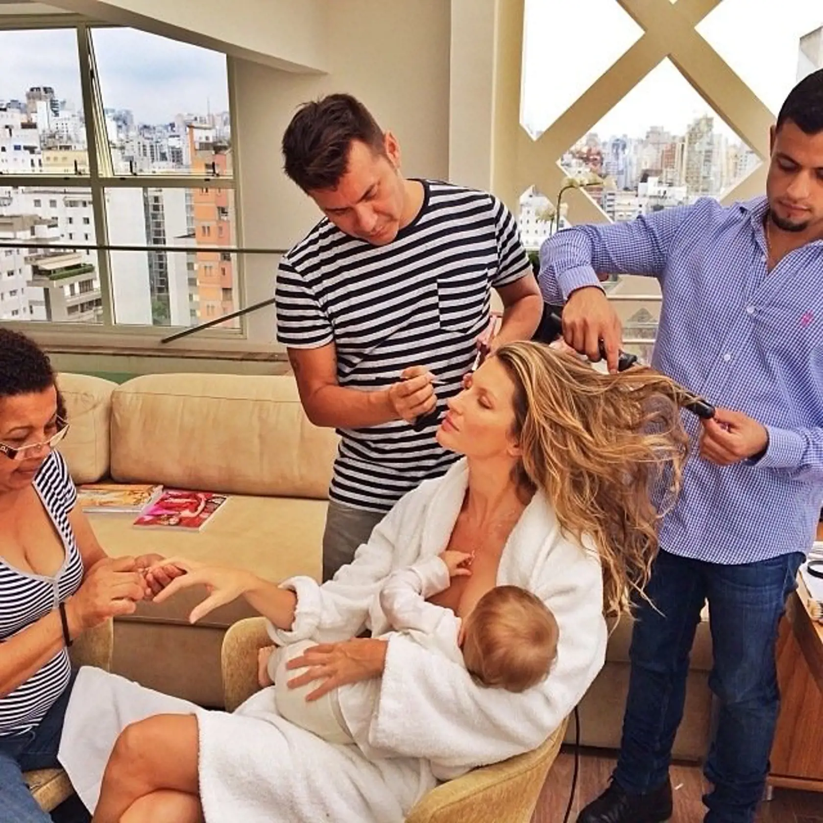 From Twitter, Instagram, and Facebook, celebrities share their private lives and thoughts with the public.  Picture shows: Gisele BÃ¼ndchen looking lovely in a white robe while holding and possibly breastfeeding baby daughter Vivian Lake Brady as her hair and makeup team gets her ready for a shoot in a cute new pic she shared. Gisele says What would I do without this beauty squad after the 15 hours flying and only 3 hours of sleep #multitasking #gettingready=â€ž=â€¦=	 O que seria de mim sem esse