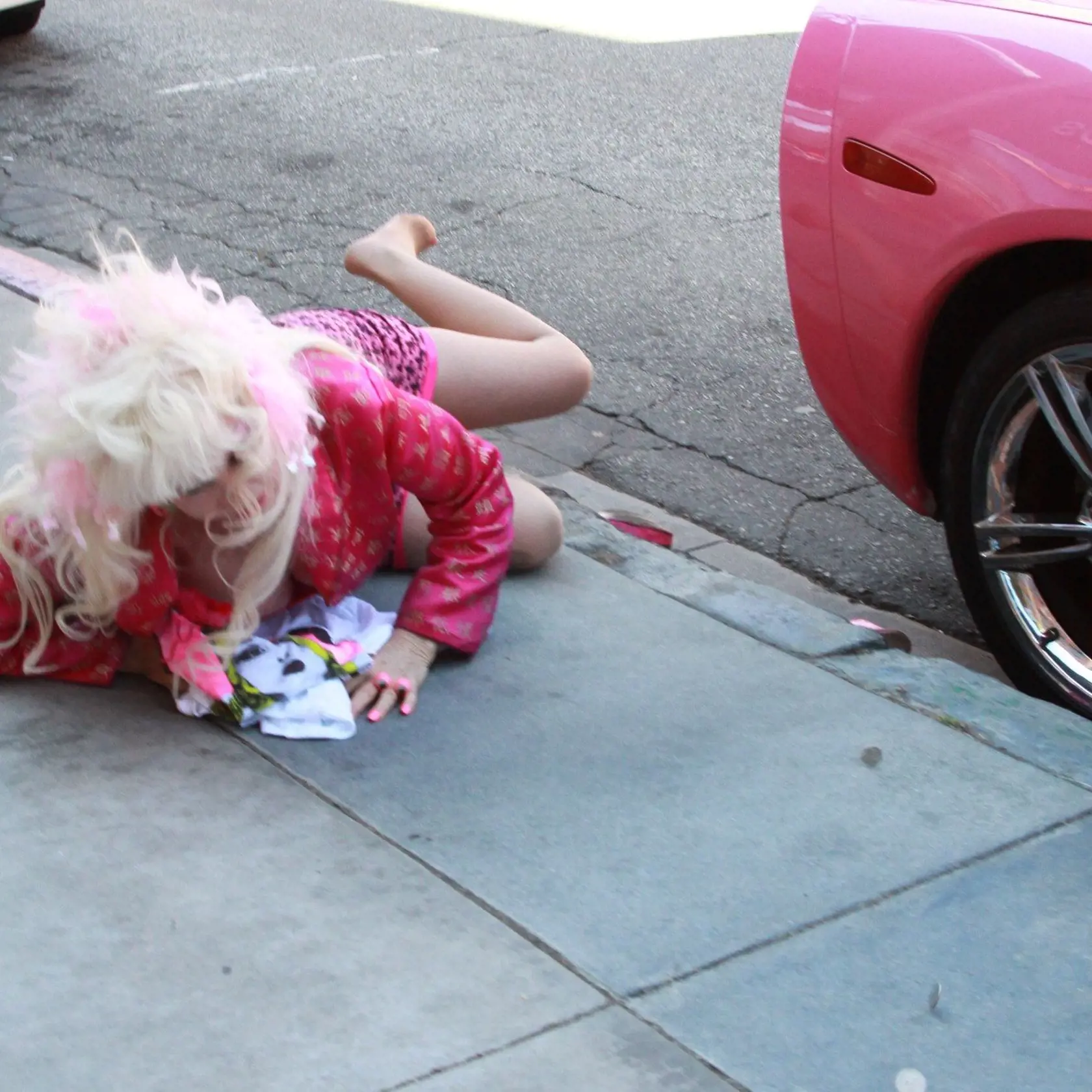 Angelyne tripped on her heels and fell down in Beverly Hills as she tried to organize her merchandise in the back of her Pink Corvette April 19, 2013., Image: 159101663, License: Rights-managed, Restrictions: , Model Release: no, Credit line: Profimedia, X17