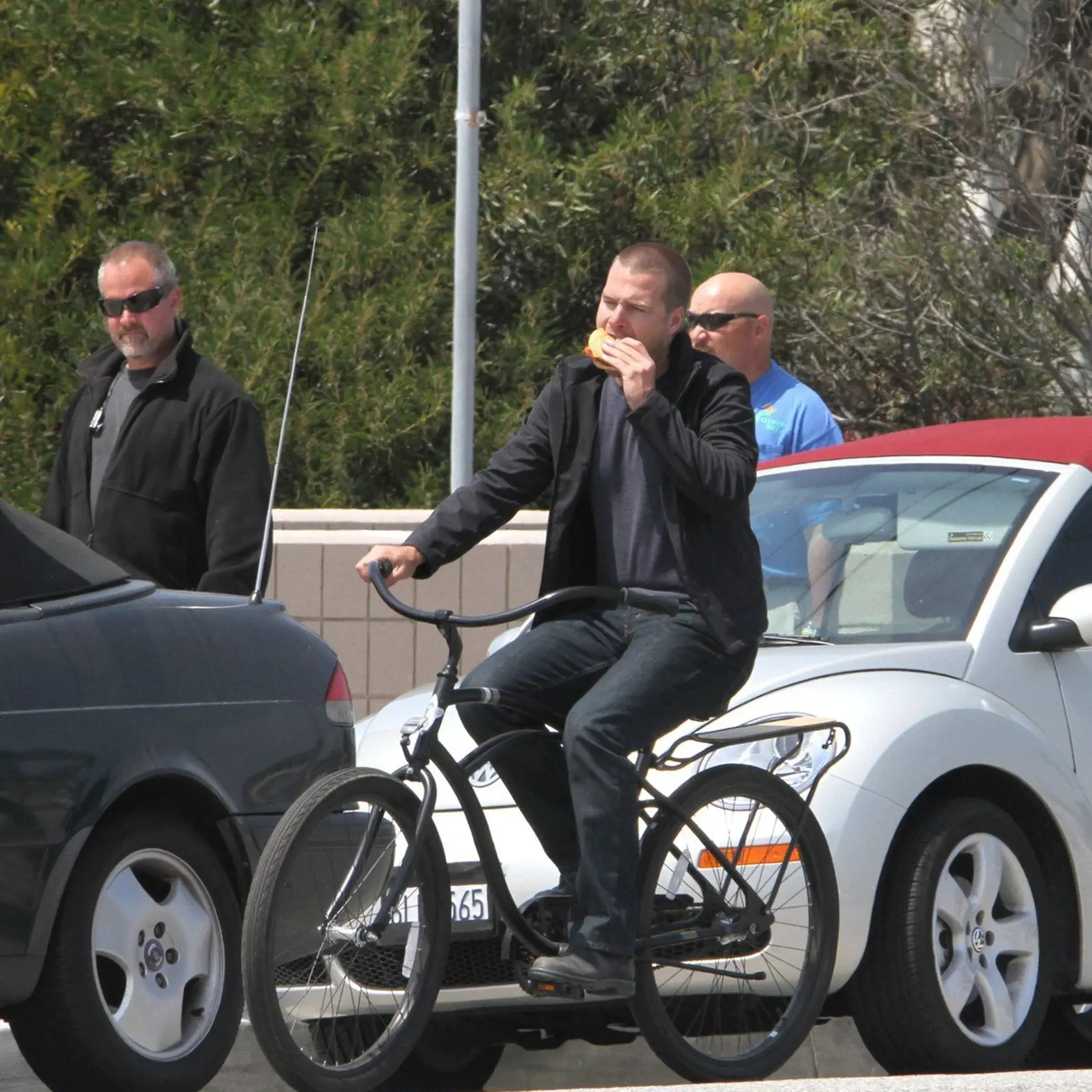 ...April 19th 2011 Exclusive ..LL Cool J goofing around laughing smiling & giving everyone on set back massages rubbing the backs & shoulders of just about every cast & crew member on set. LL was eating donuts drinking soda on the set of NCIS LA in Long Beach California. LL also was text messaging on his cell phone..Chris O'Donnell was riding his bicycle around on set while eating a hamburger. Daniela Ruah & Eric Christian Olsen joked around riding the bike together., Image: 93076164, License: R