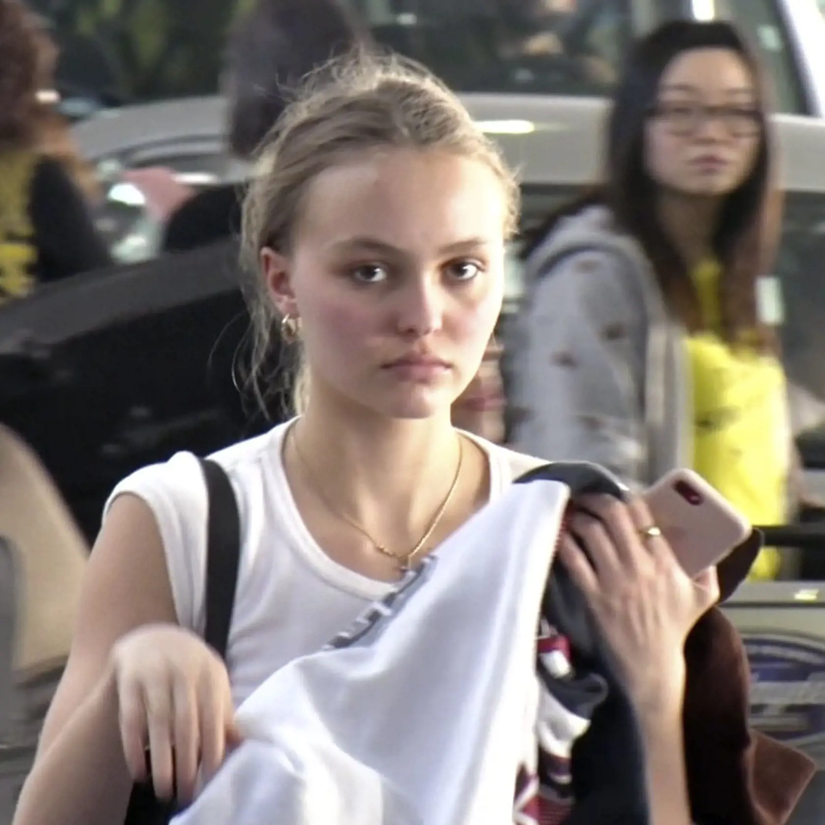 PREMIUM EXCLUSIVE Please contact X17 before any use of these exclusive photos -    Wednesday, January 24, 2018 - Top model Lily-Rose Depp is striking with no makeup as she catches a flight out of LAX, headed to France. The daughter of Johnny Depp and Vanessa Paradis gives her bodyguard a big hugg and goes casual in a celestial print t-shirt and black leggings.Tony/, Image: 361264331, License: Rights-managed, Restrictions: , Model Release: no, Credit line: Profimedia, X17