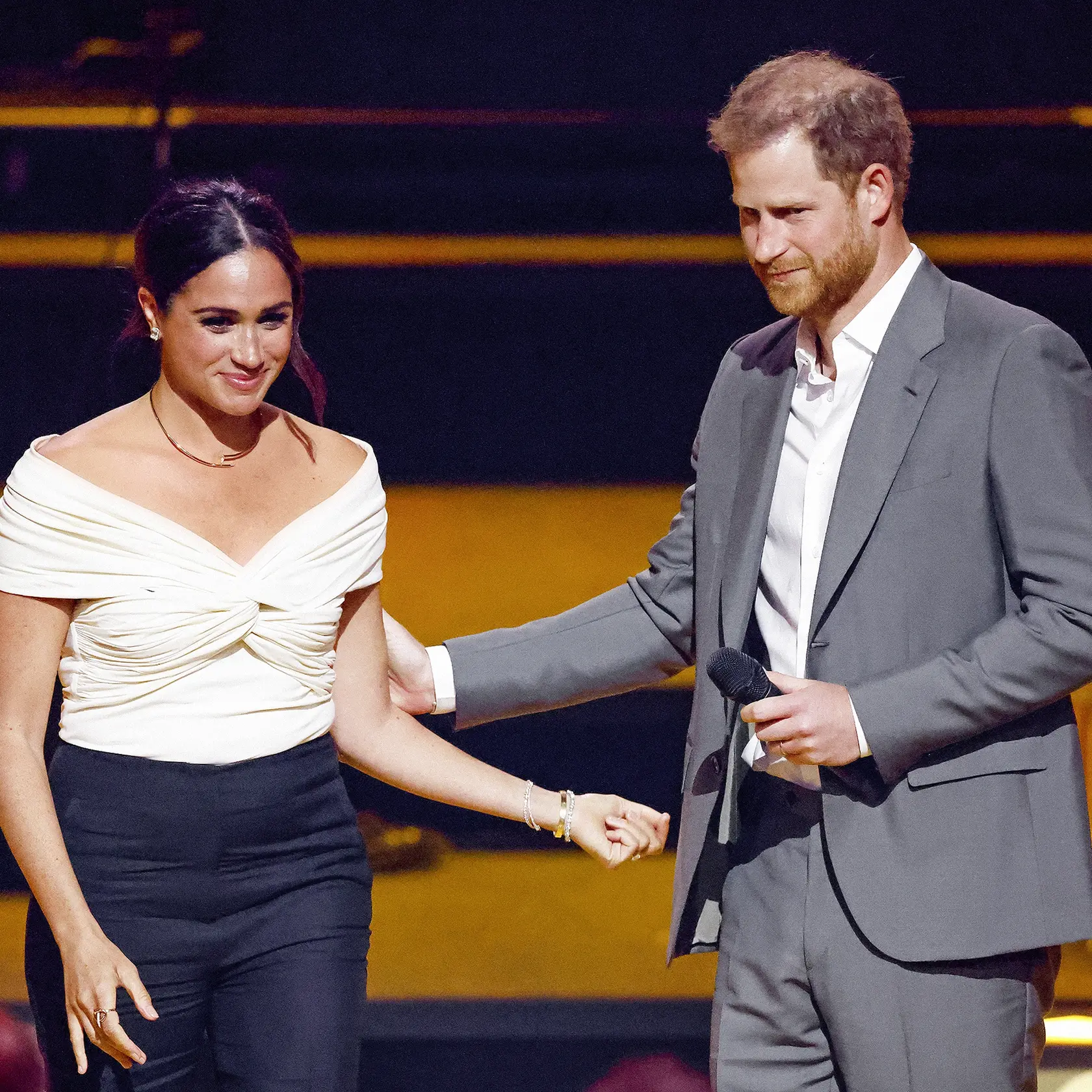 THE HAGUE, NETHERLANDS - APRIL 16: (EMBARGOED FOR PUBLICATION IN UK NEWSPAPERS UNTIL 24 HOURS AFTER CREATE DATE AND TIME) Meghan, Duchess of Sussex and Prince Harry, Duke of Sussex on stage during the Opening Ceremony of the Invictus Games 2020 at Zuiderpark on April 16, 2022 in The Hague, Netherlands. (Photo by Max Mumby/Indigo/Getty Images)