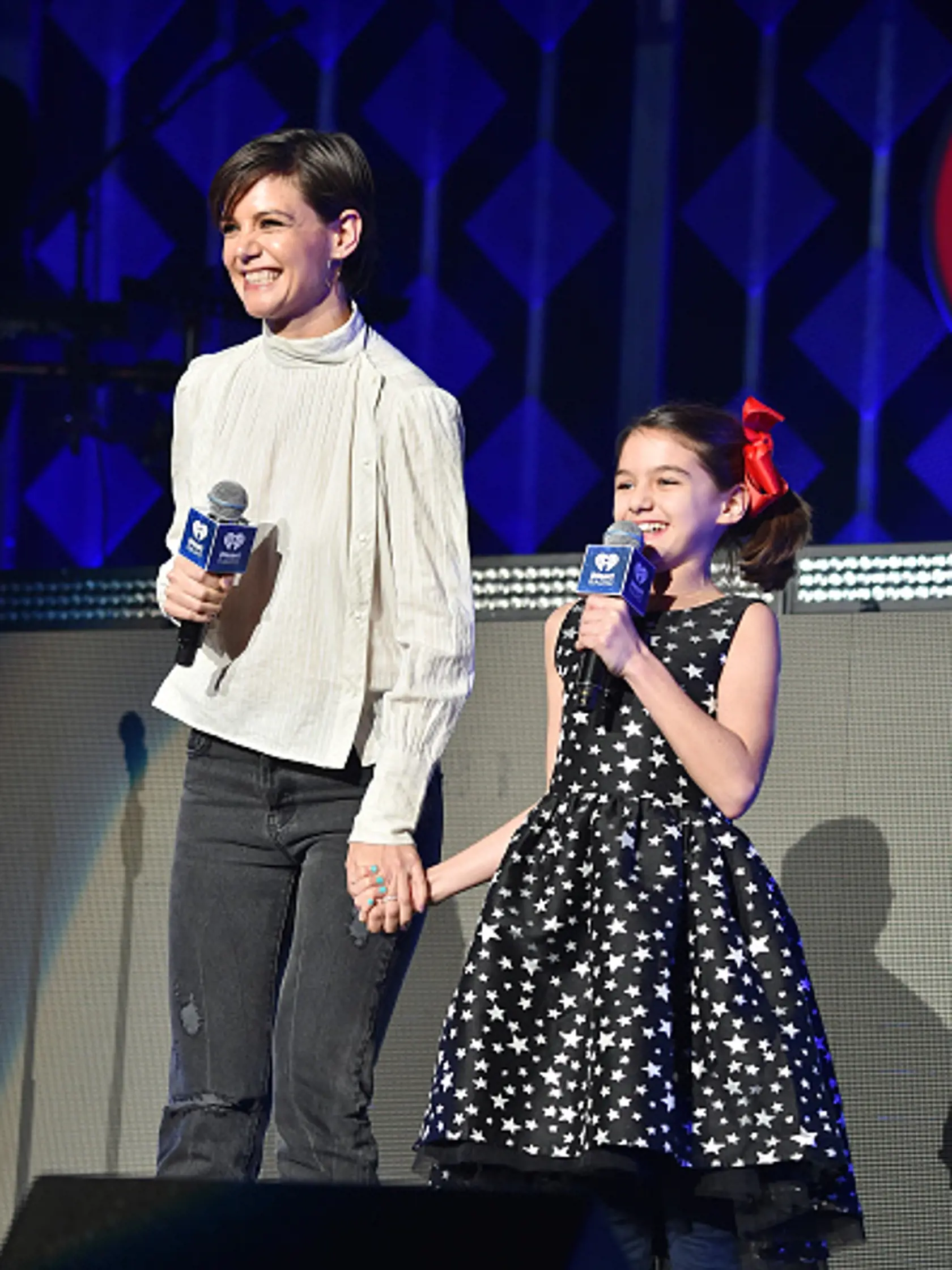 NEW YORK, NY - DECEMBER 08:  Katie Holmes and Suri Cruise speak at Z100's Jingle Ball 2017 on December 8, 2017 in New York City.  (Photo by Theo Wargo/Getty Images for iHeartMedia)