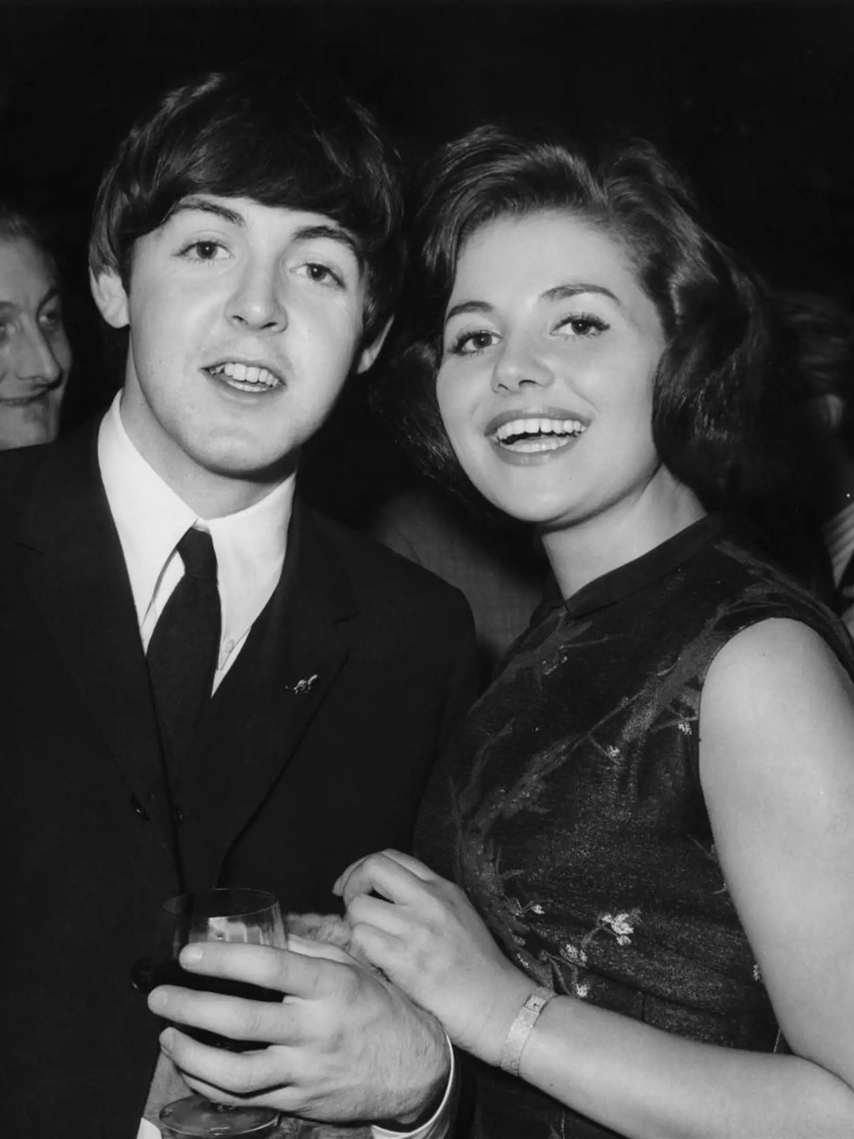 Musician and singer Paul McCartney of British rock group the Beatles with Brenda Blackler, Miss England 1964, during a party at Australia House held by the Australian High Commissioner in London, Sir Eric Harrison, 23rd April 1964. The Beatles planned a visit to Australia later that year. (Photo by Trevor Humphries/Central Press/Hulton Archive/Getty Images)