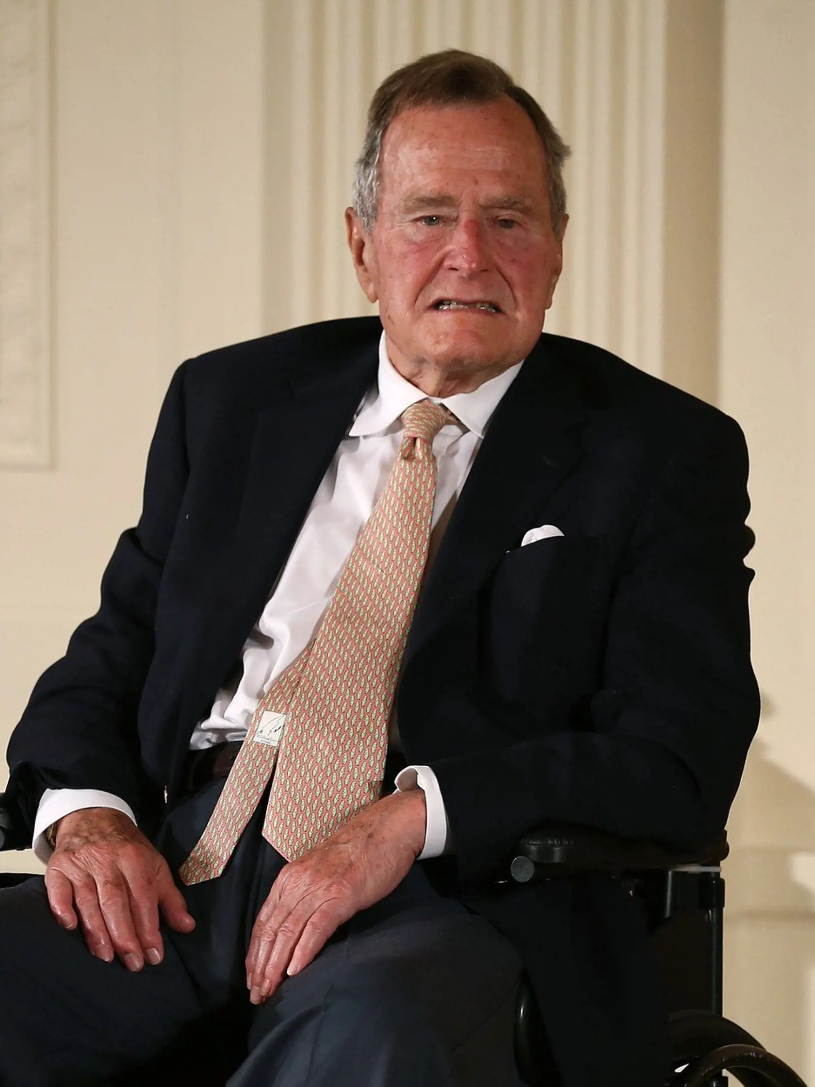 (FILES) This file photo taken on July 14, 2013 shows Former US President George H. W. Bush sitting in a wheelchair during an event in the East Room at the White House in Washington, DC.  "Former US President George HW Bush has issued an apology to an actress who accused him of groping her from his wheelchair while attending a screening, according to reports.
Heather Lind, 34, said the incident occurred four years ago at an event to promote the TV series "Turn: Washington's Spies," according to the Daily Mail, which saved a screenshot of a lengthy Instagram post she wrote and later deleted.I t is the latest in an outpouring of sexual harassment allegations against powerful male figures in entertainment, fashion and finance that followed the downfall of movie mogul Harvey Weinstein, who stands accused of assaulting and raping actresses., Image: 353836257, License: Rights-managed, Restrictions: , Model Release: no, Credit line: Profimedia, AFP
