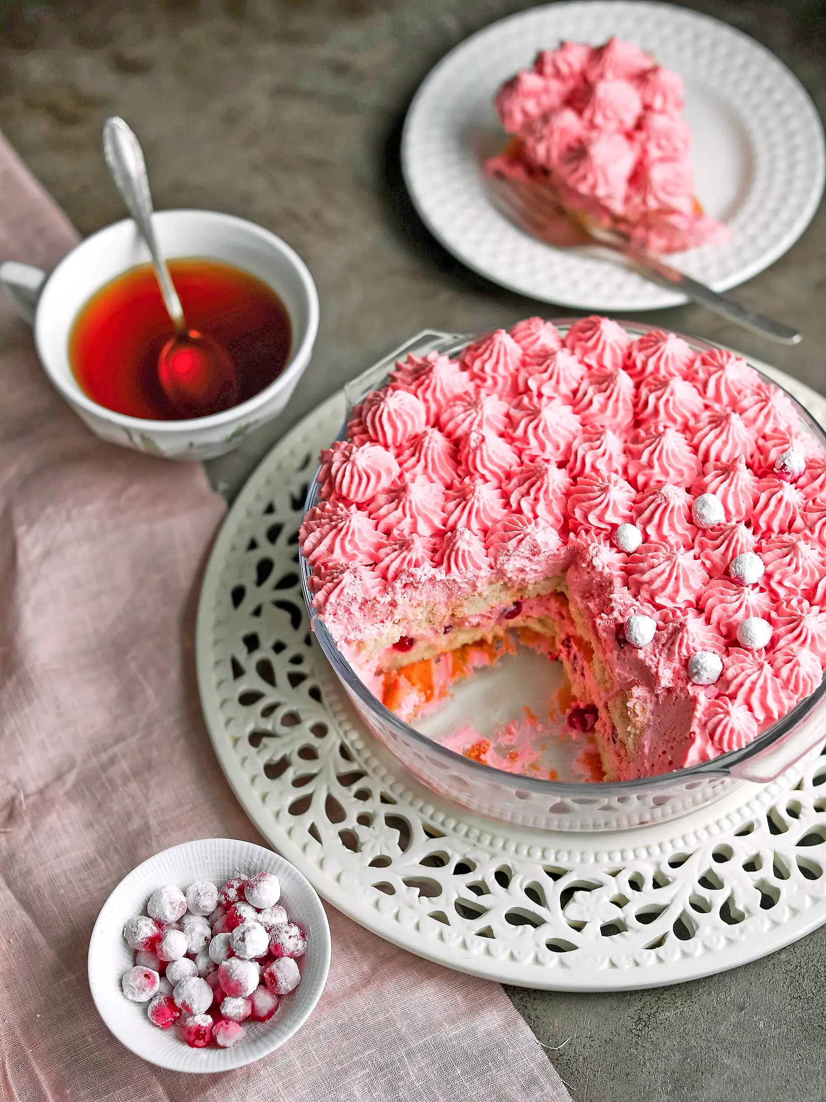 Red currant tiramisu in a light bowl. Creamy pink dessert.