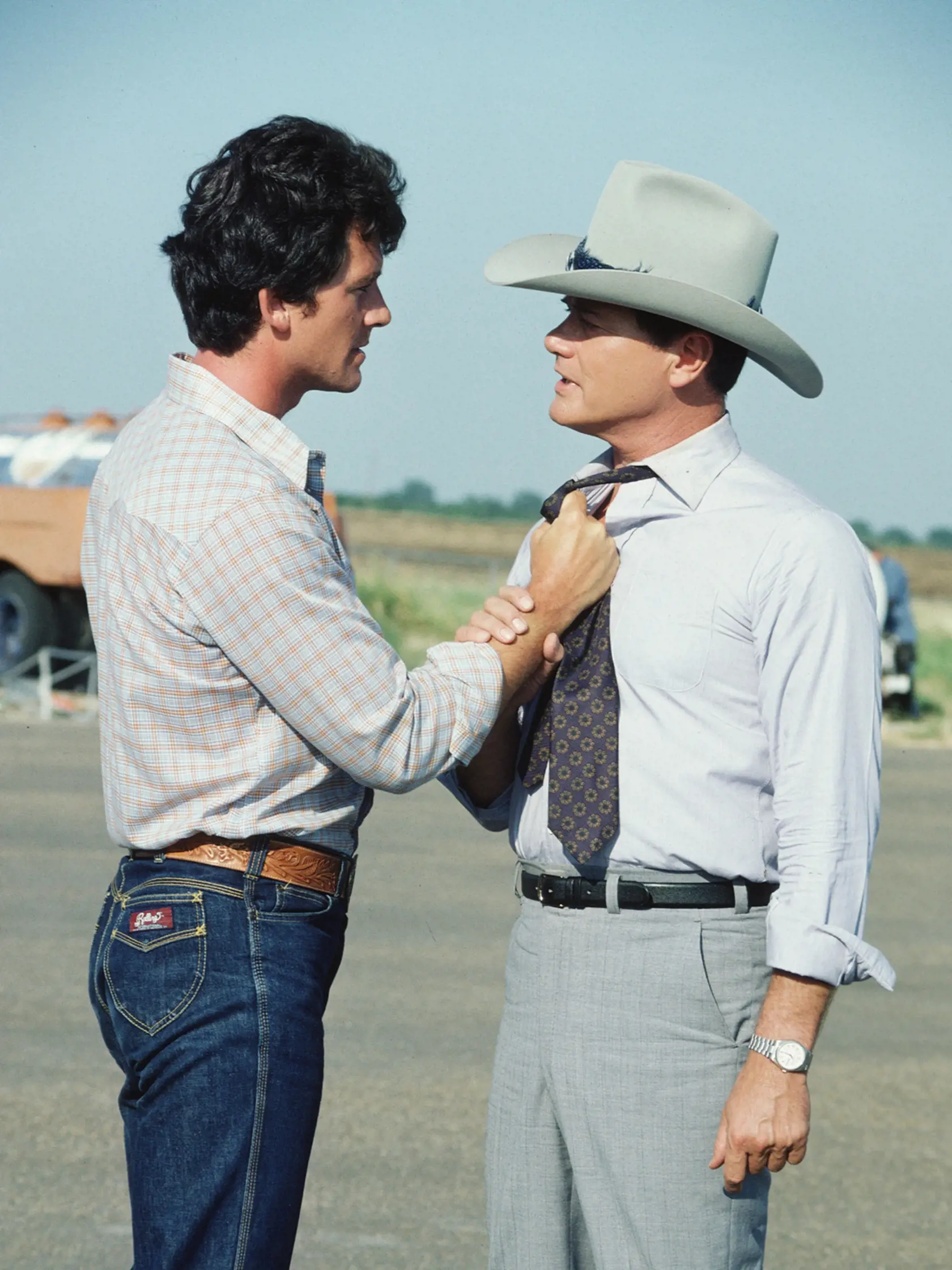 In a scene from the American television series 'Dallas,' American actor Patrick Duffy (as Bobby Ewing) threatens Larry Hagman (as John Ross 'J.R.' Ewing, Jr.), July 1980. (Photo by CBS Photo Archive/Getty Images) 